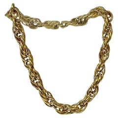 Collier triple torsion en plaqué or Nina Ricci, années 1980