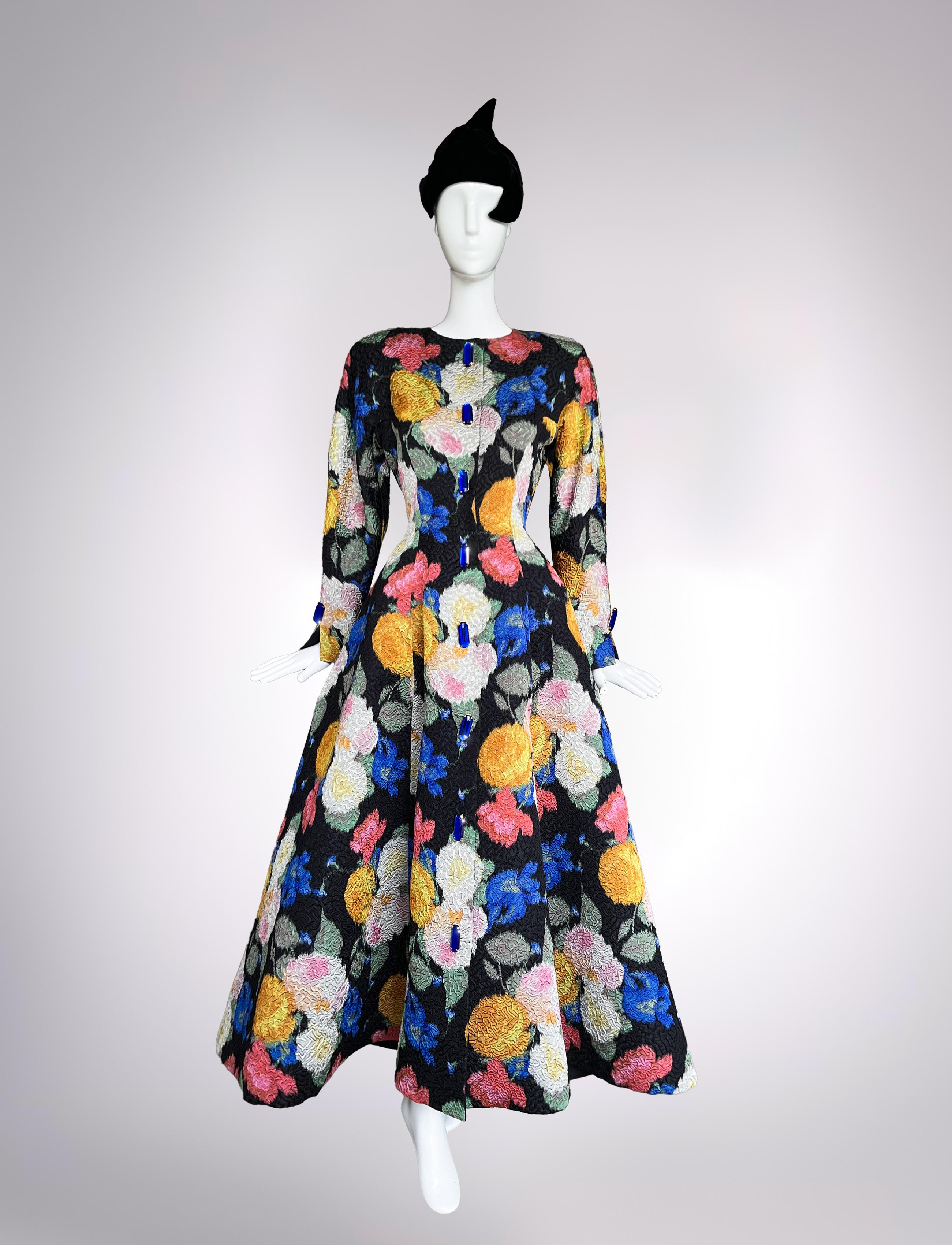 Nina Ricci Fall/Winter 1993 / 1994 Gérard Pipart stunning evening gown or coat. Met Gala Vibes! A masterclass in Haute Couture that radiates elegance, versatility, and modern artistry. 
The first thing to capture attention is the rich, floral cloqué