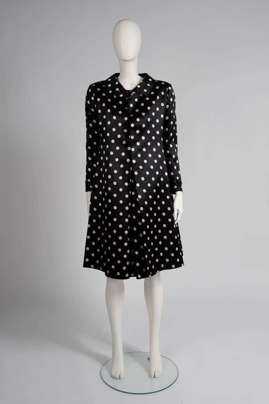 Wedding season is here and this early 60s Nina Ricci haute couture set is an elegant option for the ceremony. Made from refined satin silk printed with contrasting off-white polka dots on black background, both dress and coat finish just under the