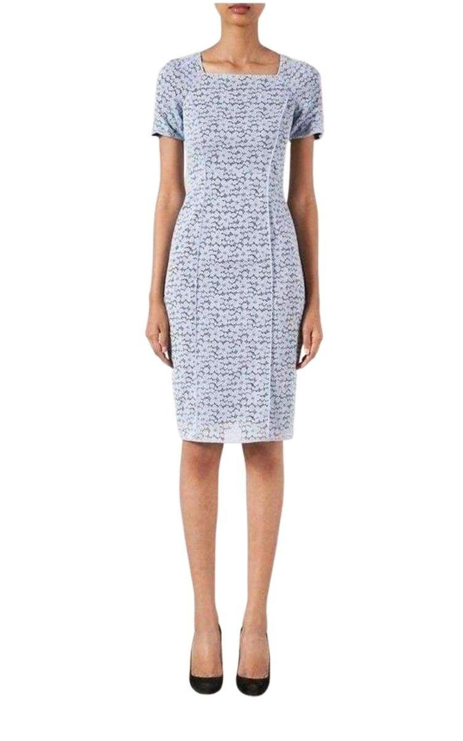 Lavender blue lace elbow sleeve fitted dress from Nina Ricci. 
Light-blue, stretch lace 
Black stretch-silk under-layer 
High square neck, short sleeves 
Light-blue seams
45% Viscose, 35% polyamide, 20% elastan
Lining: 90% silk, 10% elastan
Made in