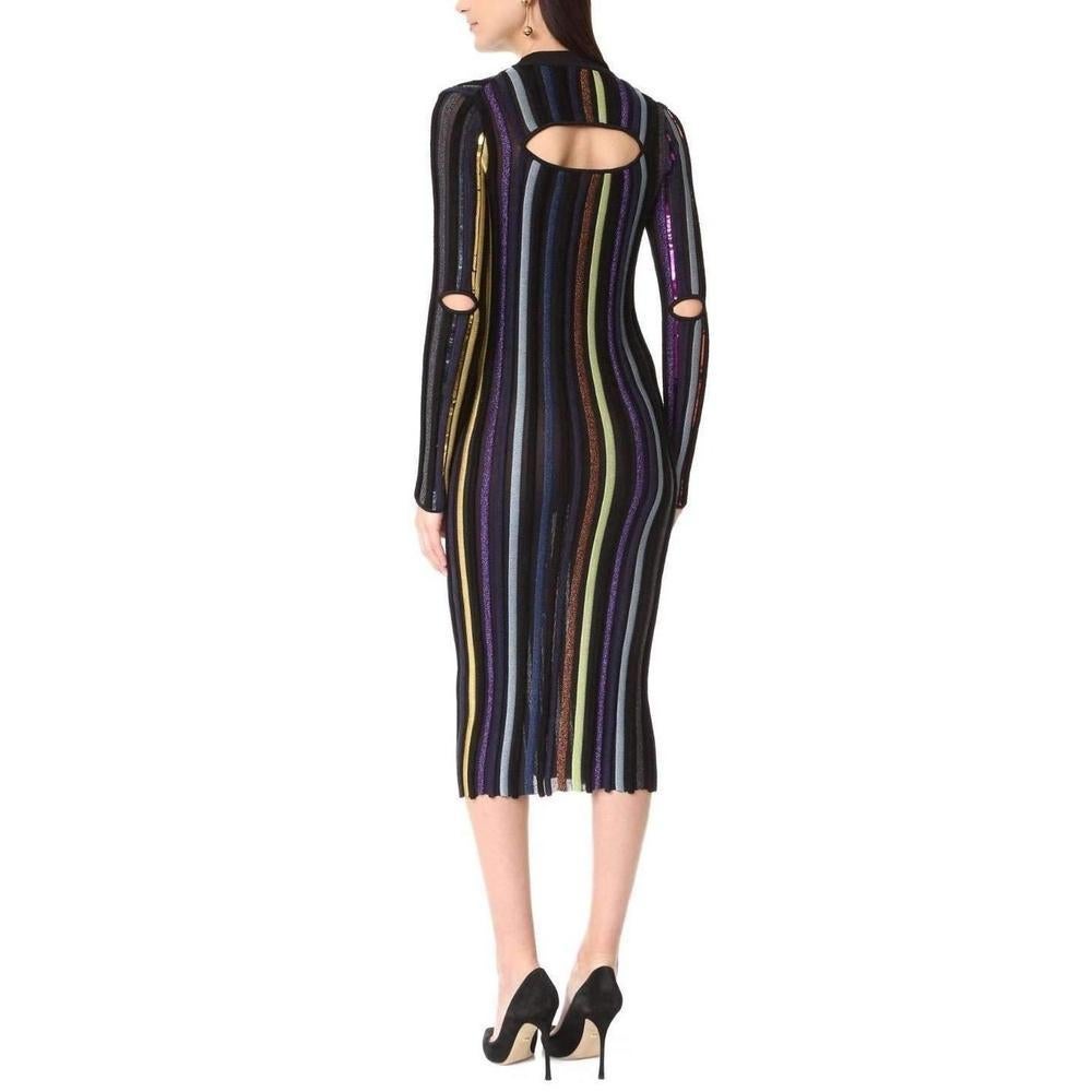 This striped, textured Nina Ricci sweater dress is detailed with mirrored sequins, metallic insets, and chenille straps.
Cutouts detail the elbows and upper back.
Crew neckline.
Long sleeves.
Unlined.
Fabric: Textured knit.
47% viscose/34%