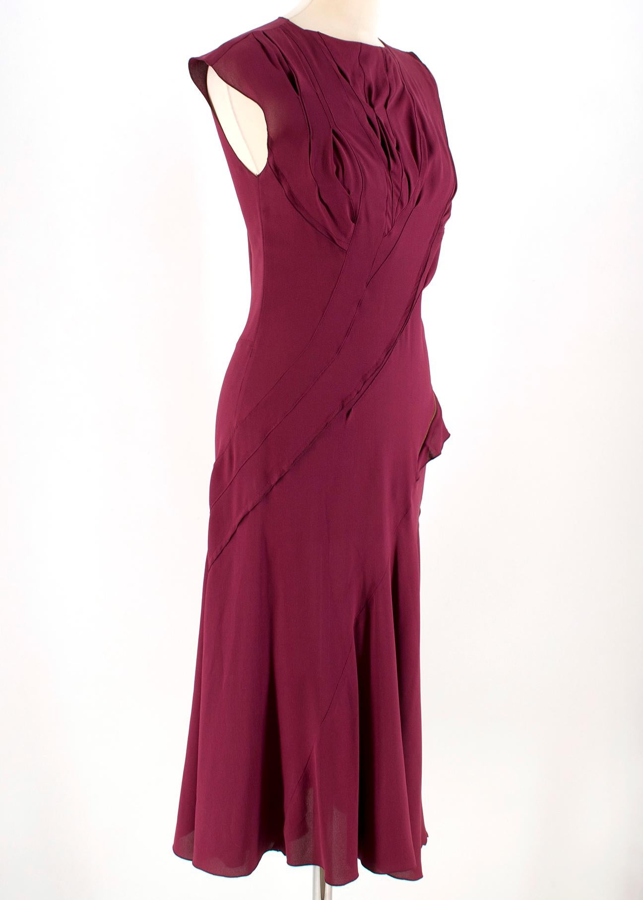 Nina Ricci Maroon Pintucked Asymmetric Zip Detail Silk Dress 

-Maroon, 100% silk
-Sleeveless 
-Pleated bust 
-Decorative gold zip on hip
-Concealed zip closure on back
-Unlined

Please note, these items are pre-owned and may show some signs of