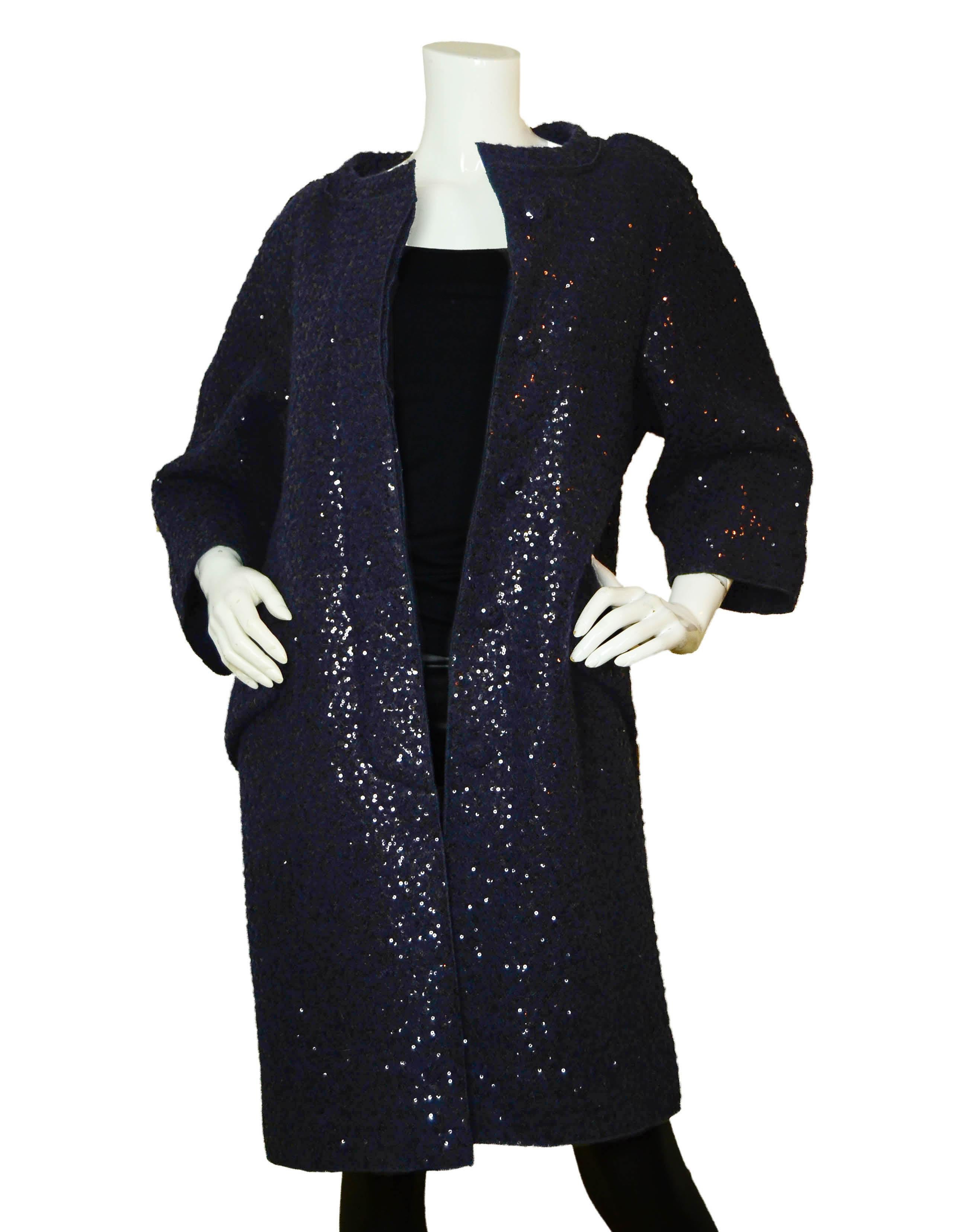 Nina Ricci Navy Sequined Boucle Coat

Made In: France
Color: Navy
Materials: 60% Wool, 40% Polyester
Opening/Closure: Button down
Overall Condition: Excellent

Tag Size: FR36/ US 2-4  *Please refer to measurements to ensure fit
Shoulder To Shoulder: