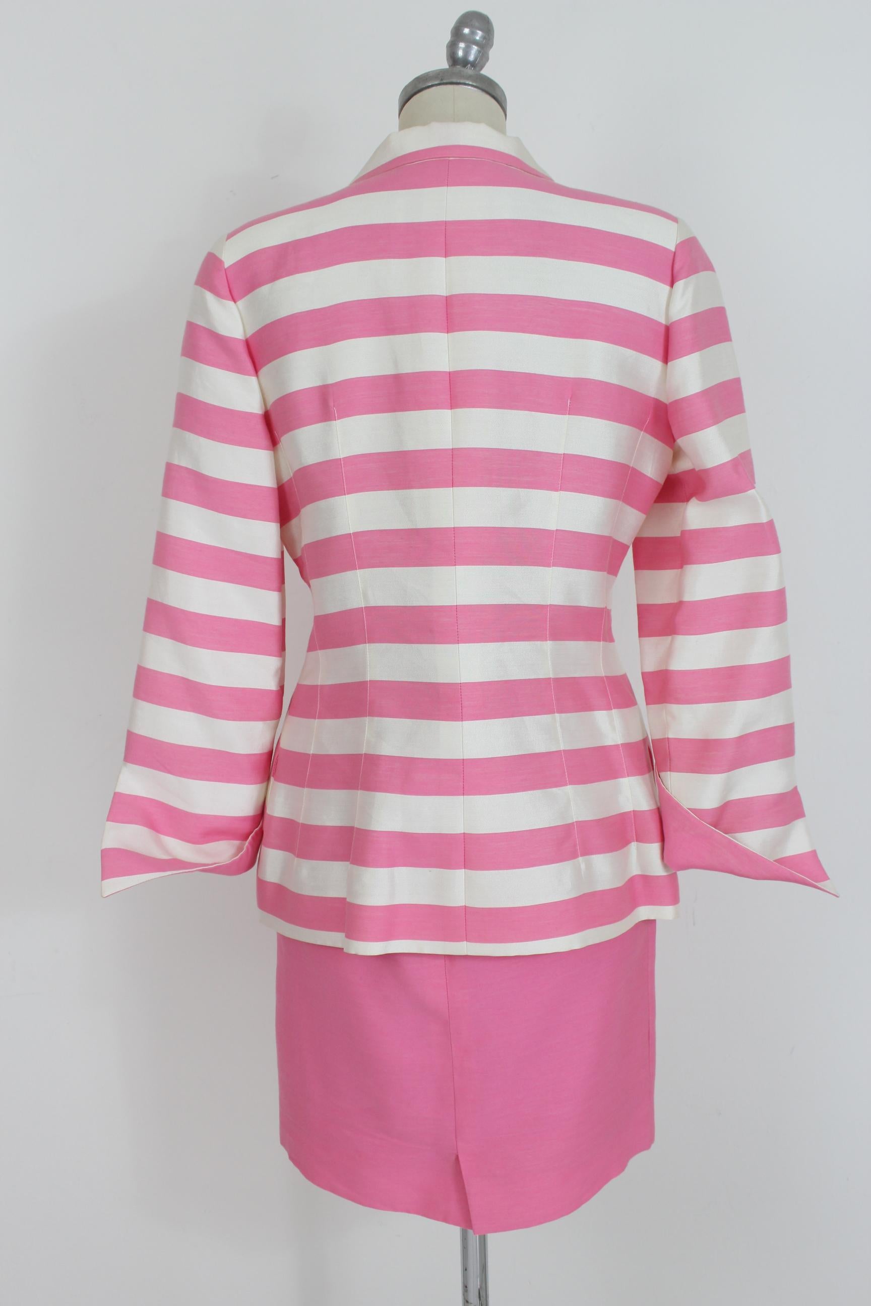 Nina Ricci Boutique 80s vintage cocktail women's skirt suit. Pink and white striped double-breasted jacket, pink sheath skirt. 50% viscose 38% cotton 12% silk. Made in France. Very good vintage conditions there are some small spots.

Size: 44 It 10