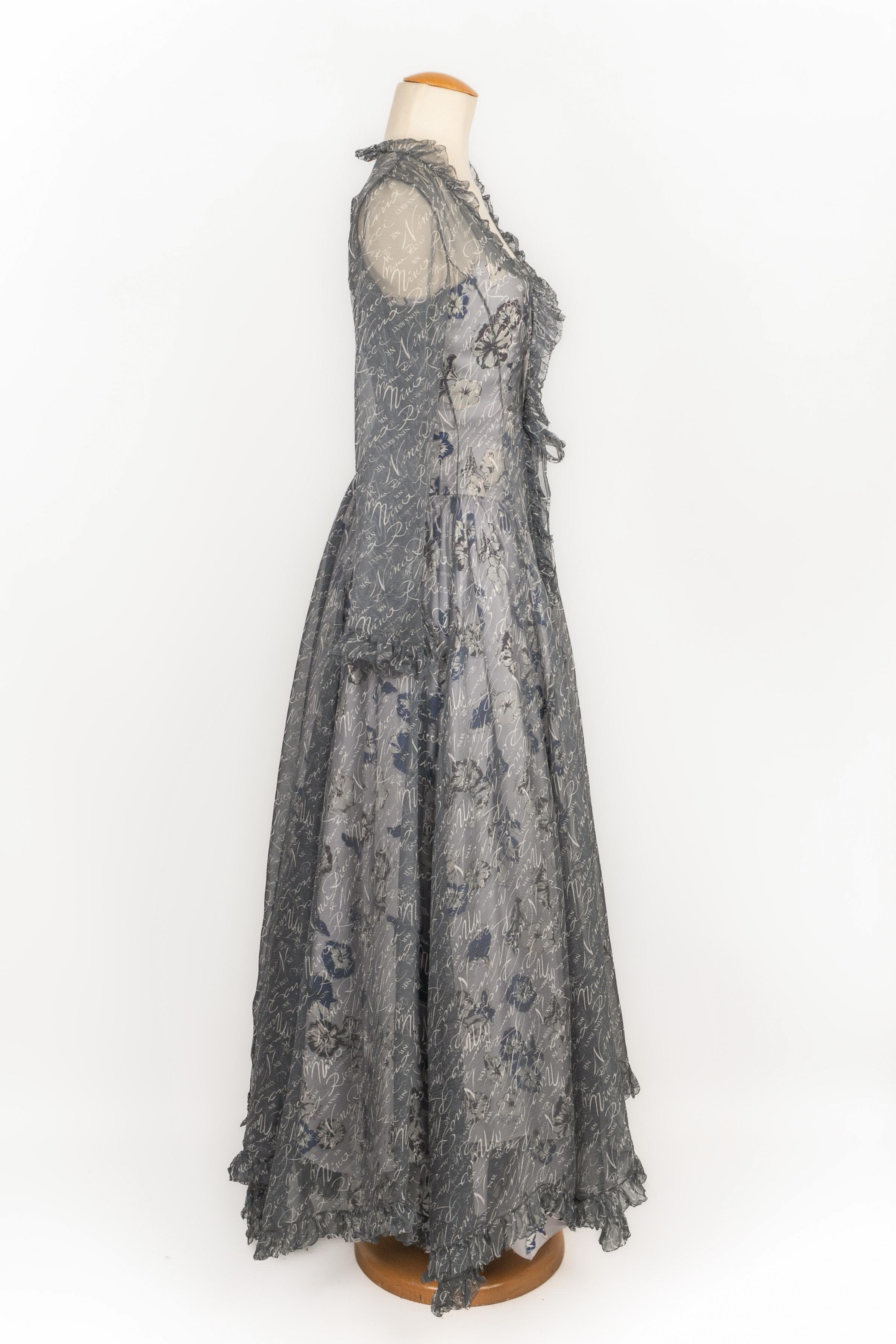 NINA RICCI - Set composed of a silk bustier dress and a muslin jacket printed with the House name. No size indicated, it fits a 34FR/36FR. 1995 Spring-Summer Collection, under the direction of Gérard Pipart.

Additional information:
Condition: Very