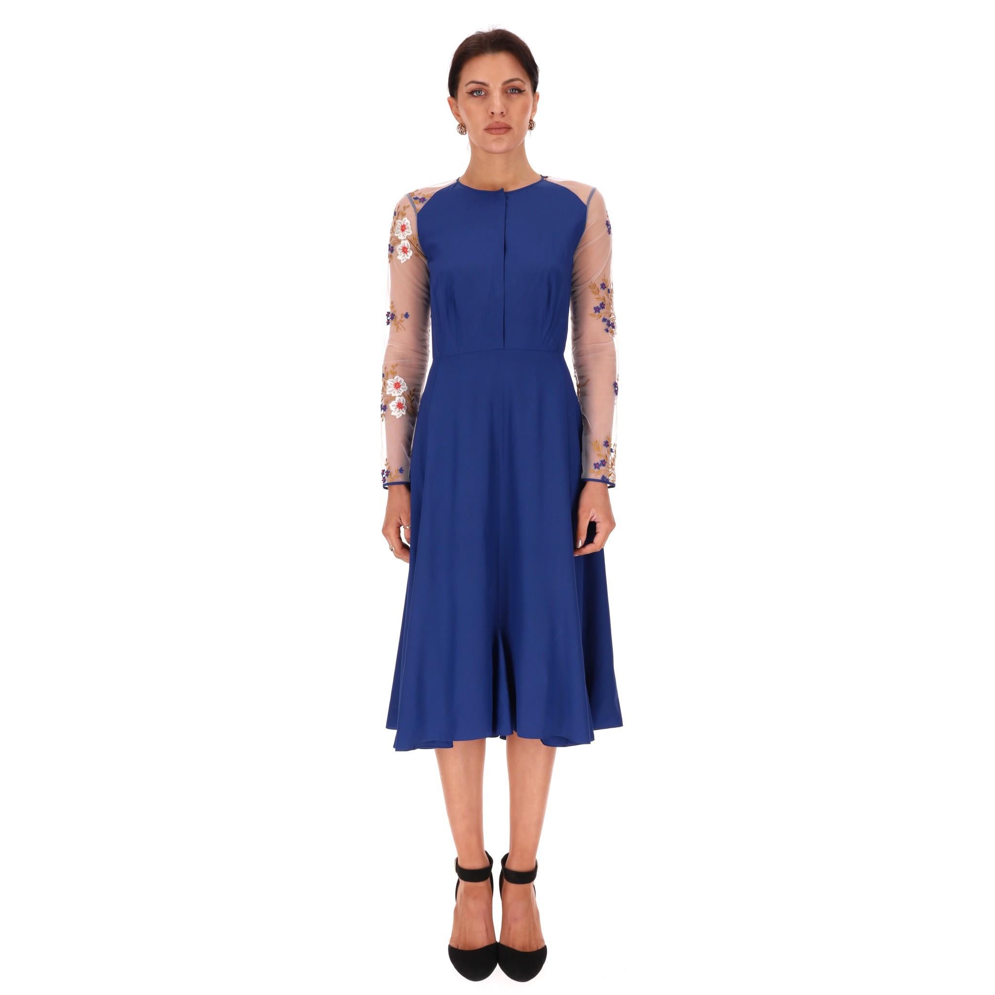 Nina Ricci Silk Dress With Sheer Floral Embroidery Detail

Blue dress fully crafted from silk and designed with white sheer sleeves and back embroidered with multicoloured floral designs.

Featuring fitted bodice, flared midi skirt and concealed zip
