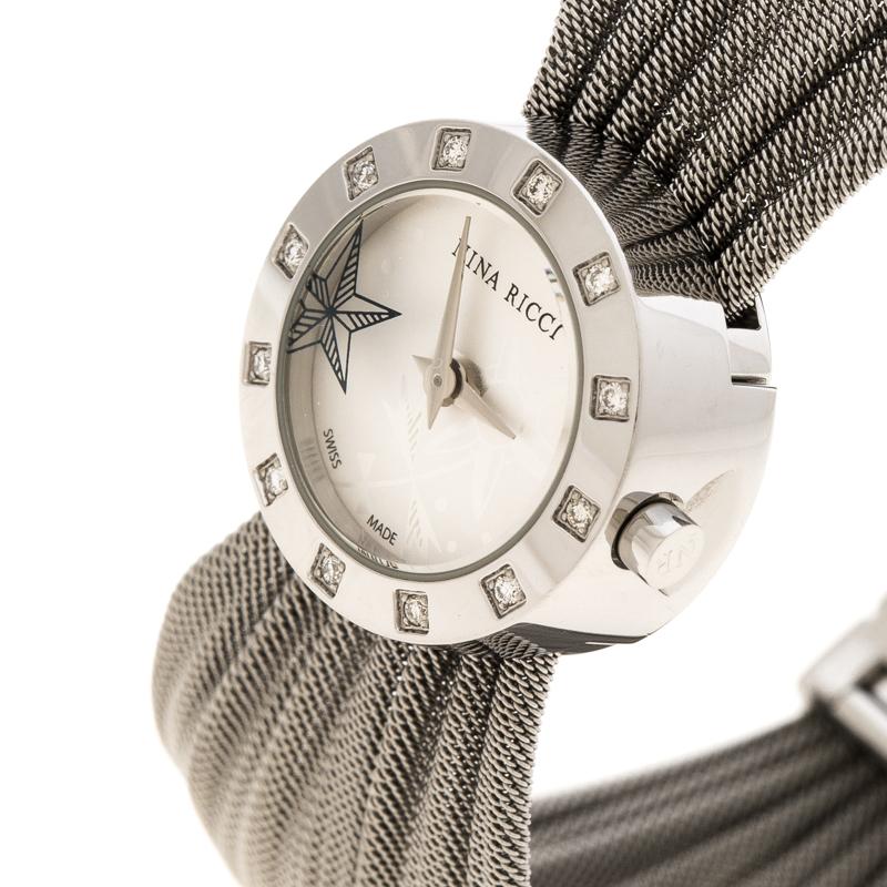 At first glance, one would think this piece is a bracelet, but it is actually a wristwatch. It is such a versatile creation. In a round stainless steel case, a silver-white dial sits with two hands, star detailing and the label, while diamonds are