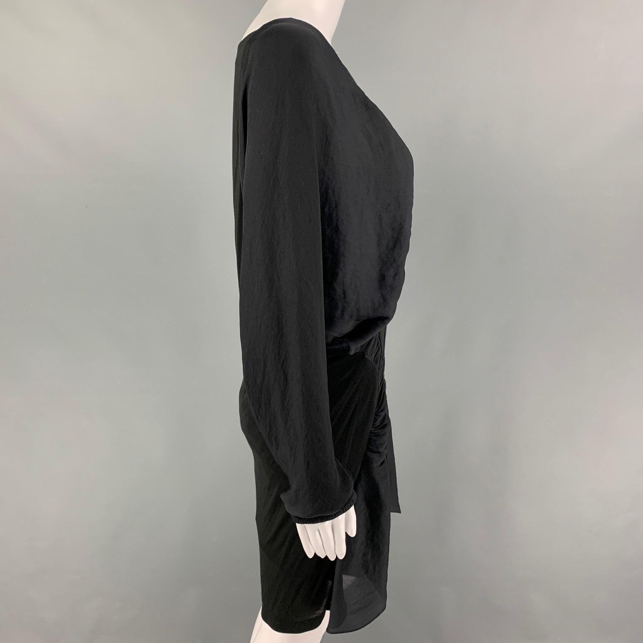 NINA RICCI dress comes in a grey & black mixed fabrics featuring dolman sleeves, ruched details, and a scoop neck. Made in France.
Very Good
Pre-Owned Condition. 

Marked:   36 

Measurements: 
 
Shoulder: 15.5 inches Bust: 40 inches Waist: 28