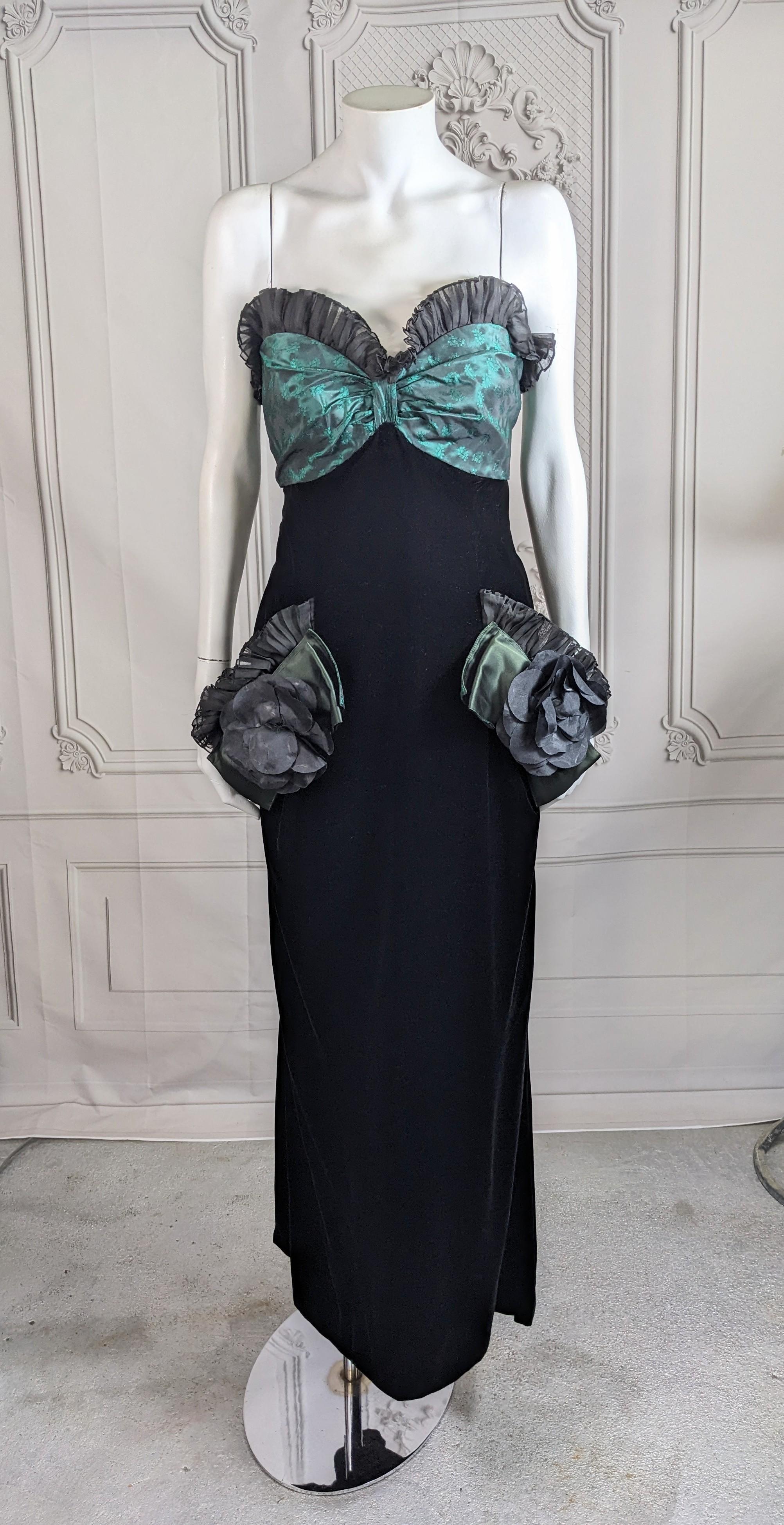 Elegant Nina Ricci Strapless Velvet Organza Brocade Column Gown from the 1980's.  Velvet column with green brocade ruching trimmed in pleated organza. The faux pockets are trimmed with taffeta bows and silk flowers as well. Has interior boning