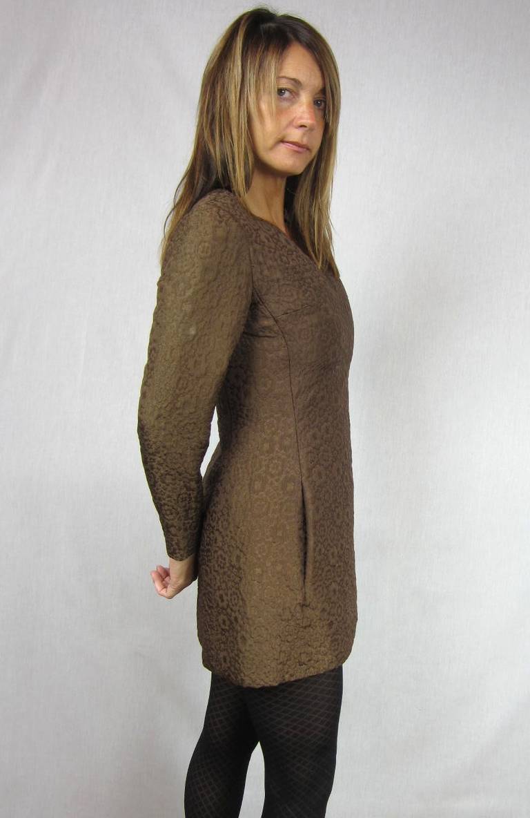 Stunning quilted Nina Ricci chocolate Brown  tunic and pants. Hidden slit pockets. zippers down the back. Tunic can also be worn as a dress or with Matching pants** Measuring- Tunic- up to 32 inch Bust- up to 29 inch waist- 22 inch sleeve ** Pants--
