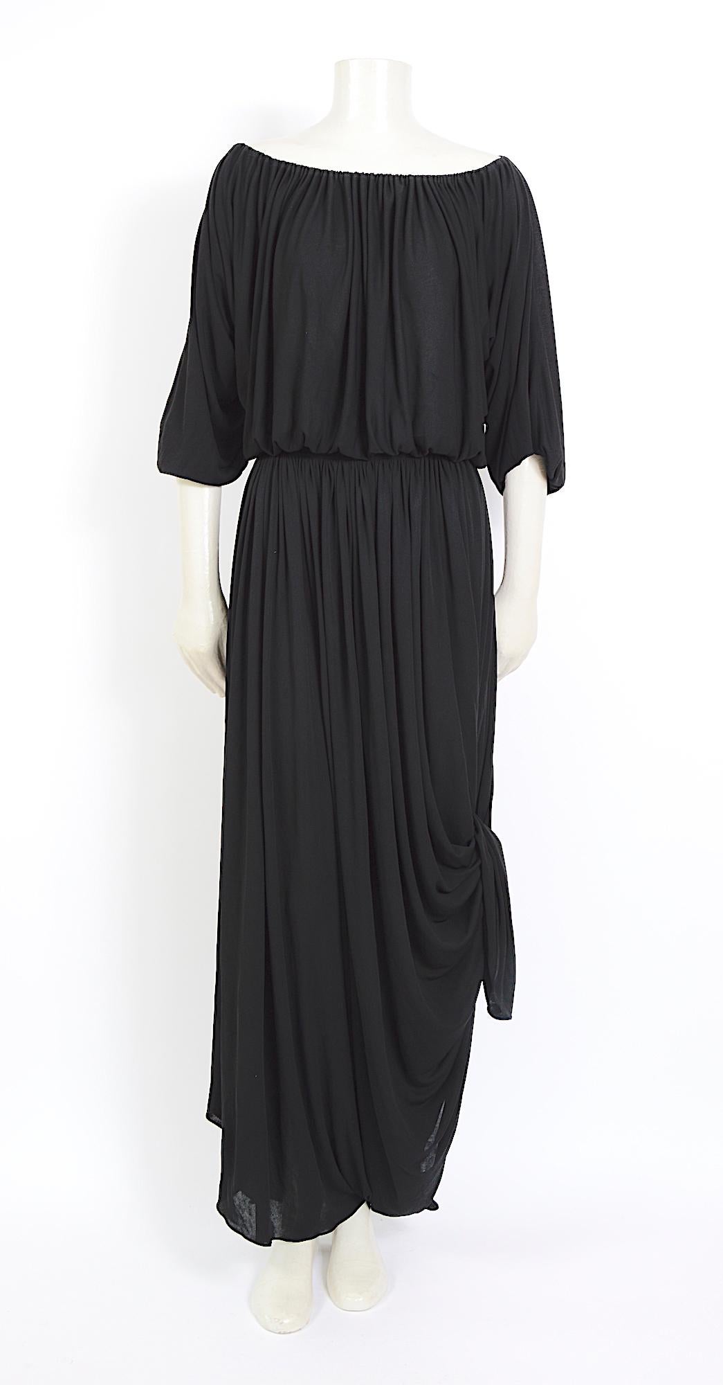 Collectible vintage Nina Ricci 1970s dress.
I love the draping styling options on this vintage 1970s Nina Ricci dress. Made in a beautiful black viscose jersey dress. A few tiny pin-size holes, are hard to find and lost in the drapes of the dress.
