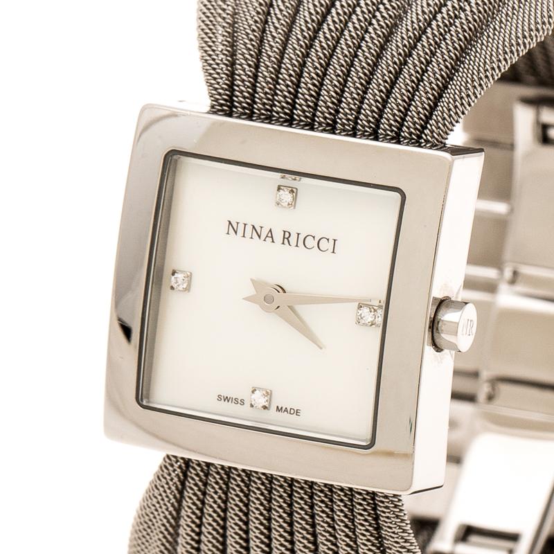 At first glance, one would think this piece is a bracelet, but it is actually a wristwatch. It is such a versatile creation. In a square stainless steel case, a Mother of Pearl dial sits with two hands, the brand's signature and four stone hour