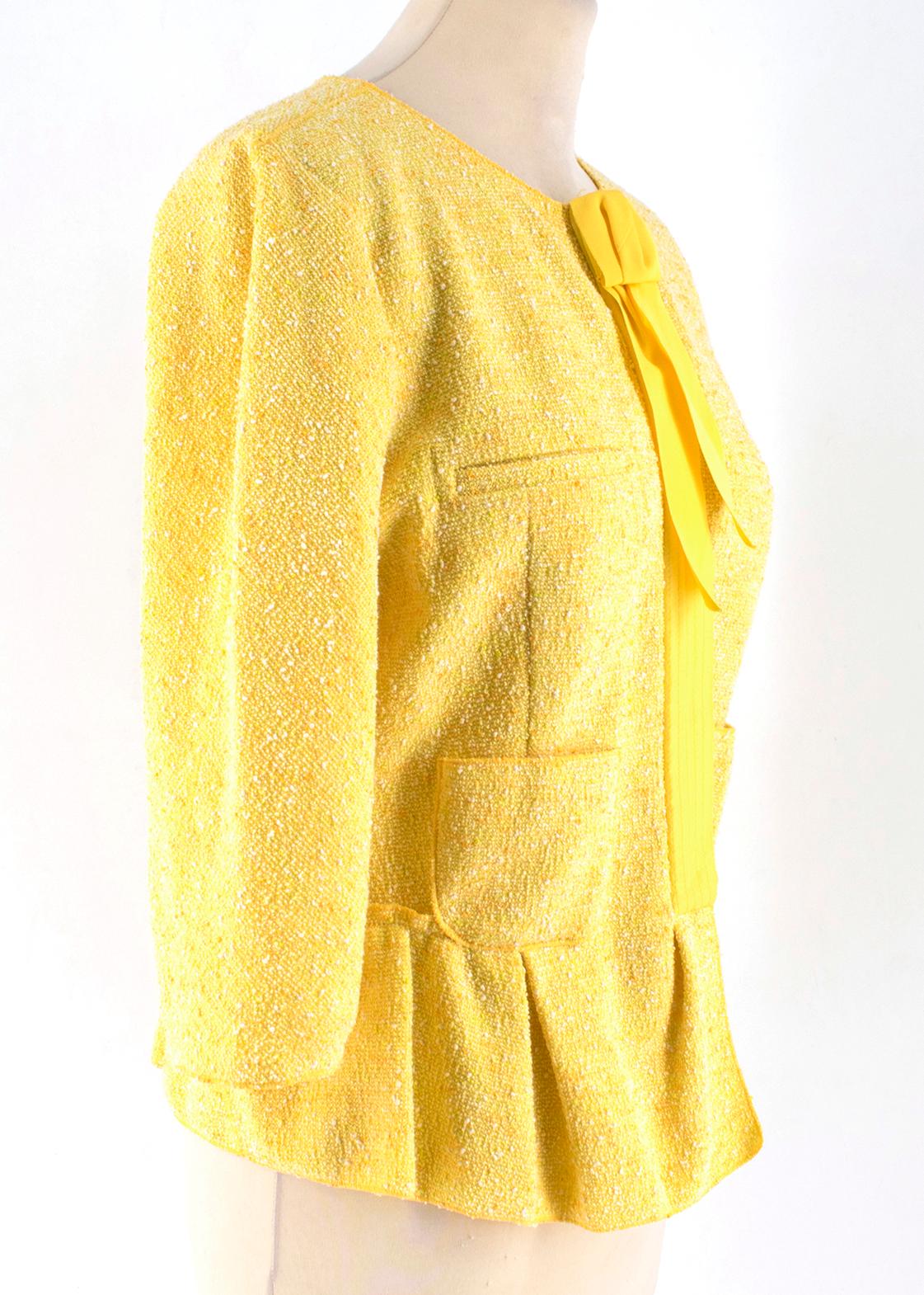 Nina Ricci Yellow Tweed Jacket

- Yellow tweed jacket
- Lightweight
- Crew neck
- Centre-front concealed stud snap fastening
- 3/4 sleeve length
- Front pockets
- Peplum hem
- 70% cotton, 15% viscose, 12% polyamide, 3% elastan

Please note, these