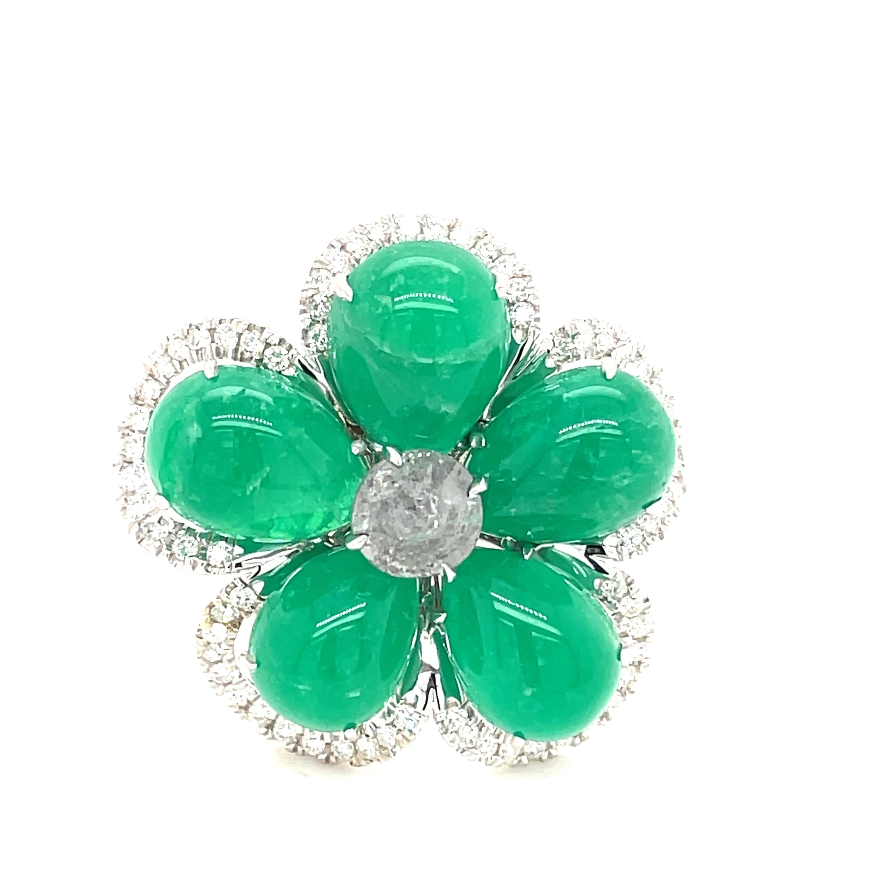 Gorgeous Emerald, Diamond and White Gold Ring.  The emerald cabochons create New York native Nina Runsdorf is known for her wearable, one-of-a-kind jewelry made from precious and semi-precious stones.
Stamped 18K and NR.
1 inch width at the widest