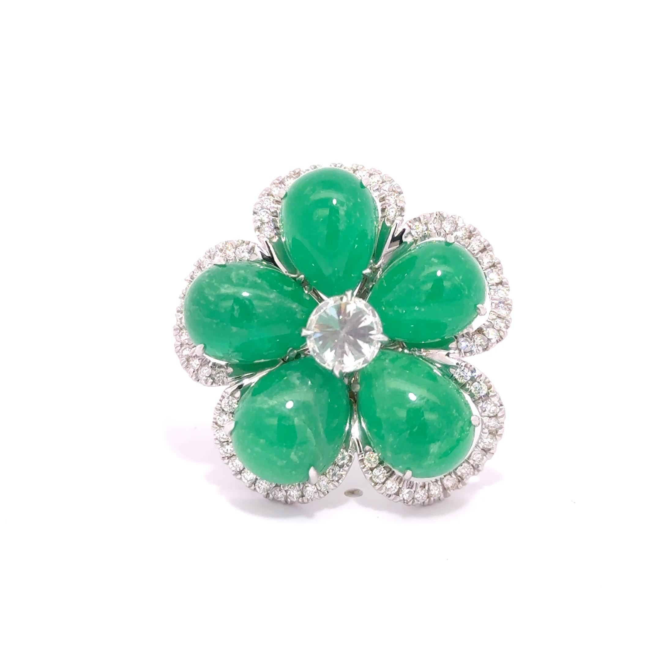 Gorgeous Emerald, Diamond and White Gold Ring.  The emerald cabochons create New York native Nina Runsdorf is known for her wearable, one-of-a-kind jewelry made from precious and semi-precious stones.
Stamped 18K and NR.
1 inch width at the widest