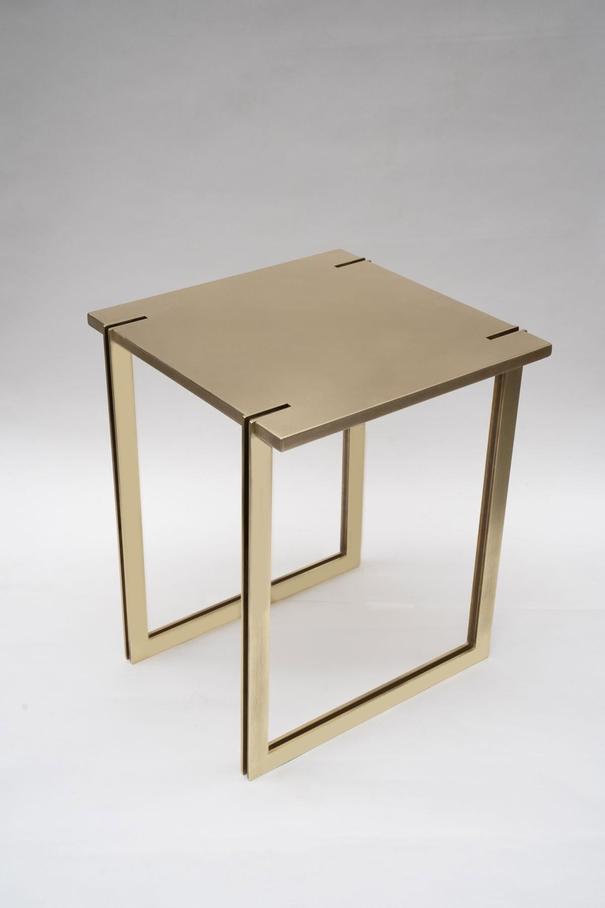 NINA side table legs are inlayed into the table top, sitting flush with the satin brass top surface and extruding 1/4