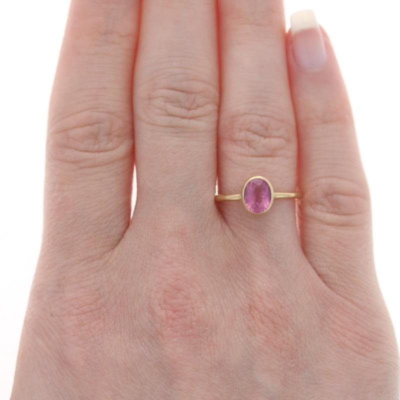 Size: 6 3/4
Sizing Fee: Up 1 size for $40 or Down 1 size for $40

Brand: Nina Wynn

Metal Content: 18k Yellow Gold

Stone Information
Natural Pink Tourmaline
Carat(s): .90ct
Cut: Oval

Total Carats: .90ct

Style: Solitaire
Features: Textured