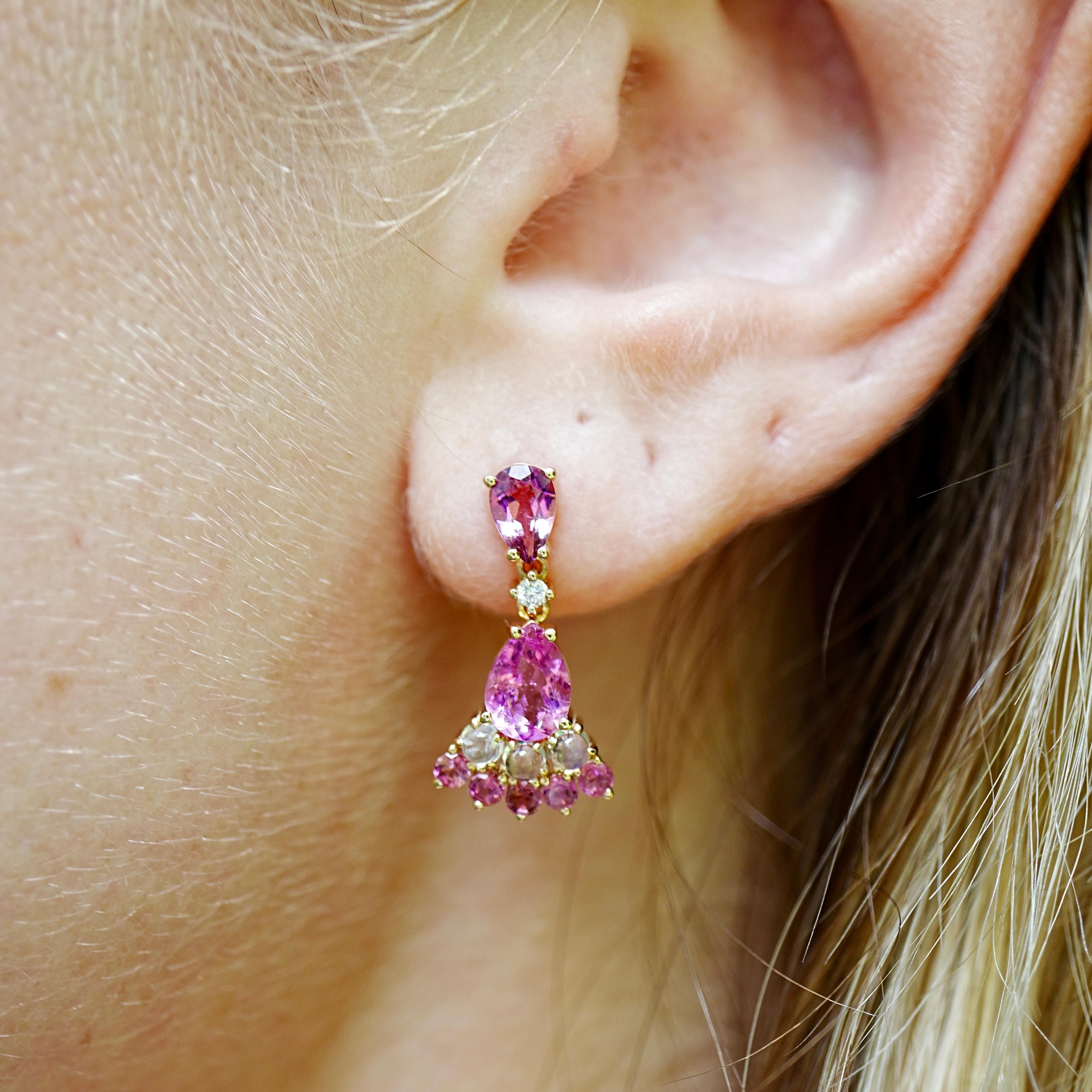 Vivid yet graceful, the Nina Zhou 2.74ctw Pink Tourmaline, Moonstone & Diamond Drop Earrings bring a striking play of color to any collection. Two pear-cut pink tourmalines take center stage, their saturated hues accented by the iridescent glow of