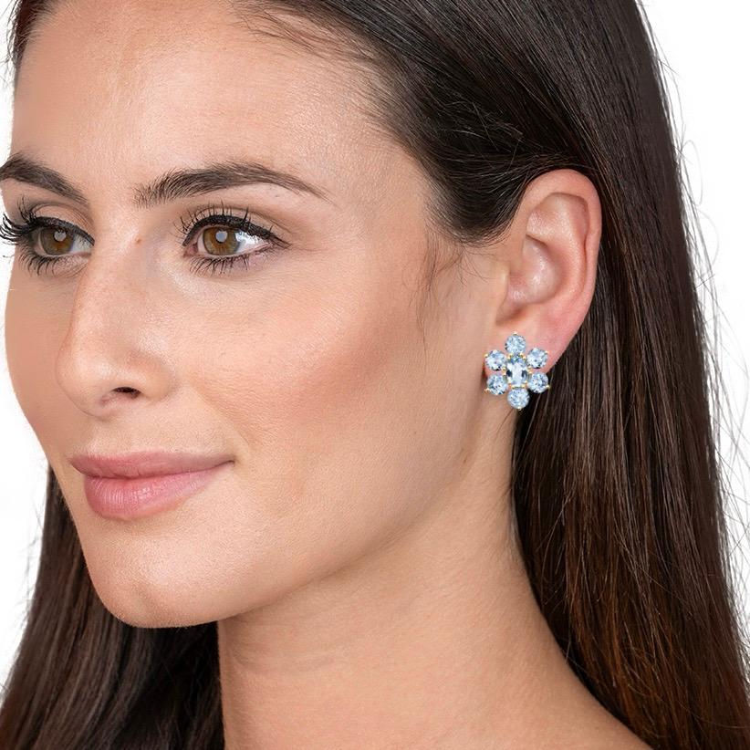 Nina Zhou's 7.00ct Aquamarine Cluster Earrings, masterfully crafted in sumptuous 18k yellow gold. Each earring was made with magnificent aquamarine, celebrated for its vibrant, oceanic blue that captures the essence of tranquil seas. Surrounding the