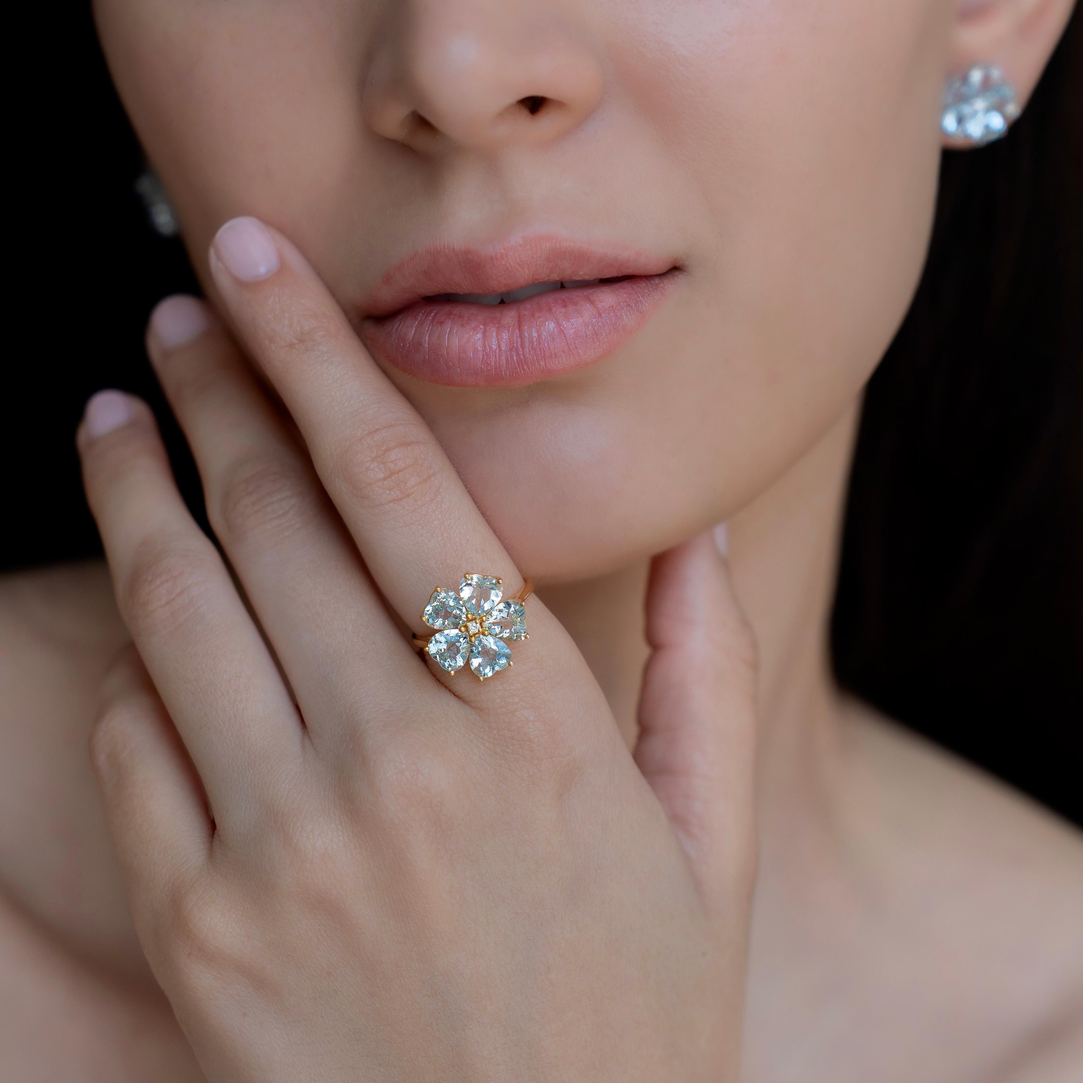 Capture the essence of spring with the 4.03 ctw Aquamarine & Diamond Cherry Blossom Ring. This design features sky-blue, heart-cut aquamarine gemstones arranged in a cherry blossom pattern, each radiating with high clarity. A brilliant diamond