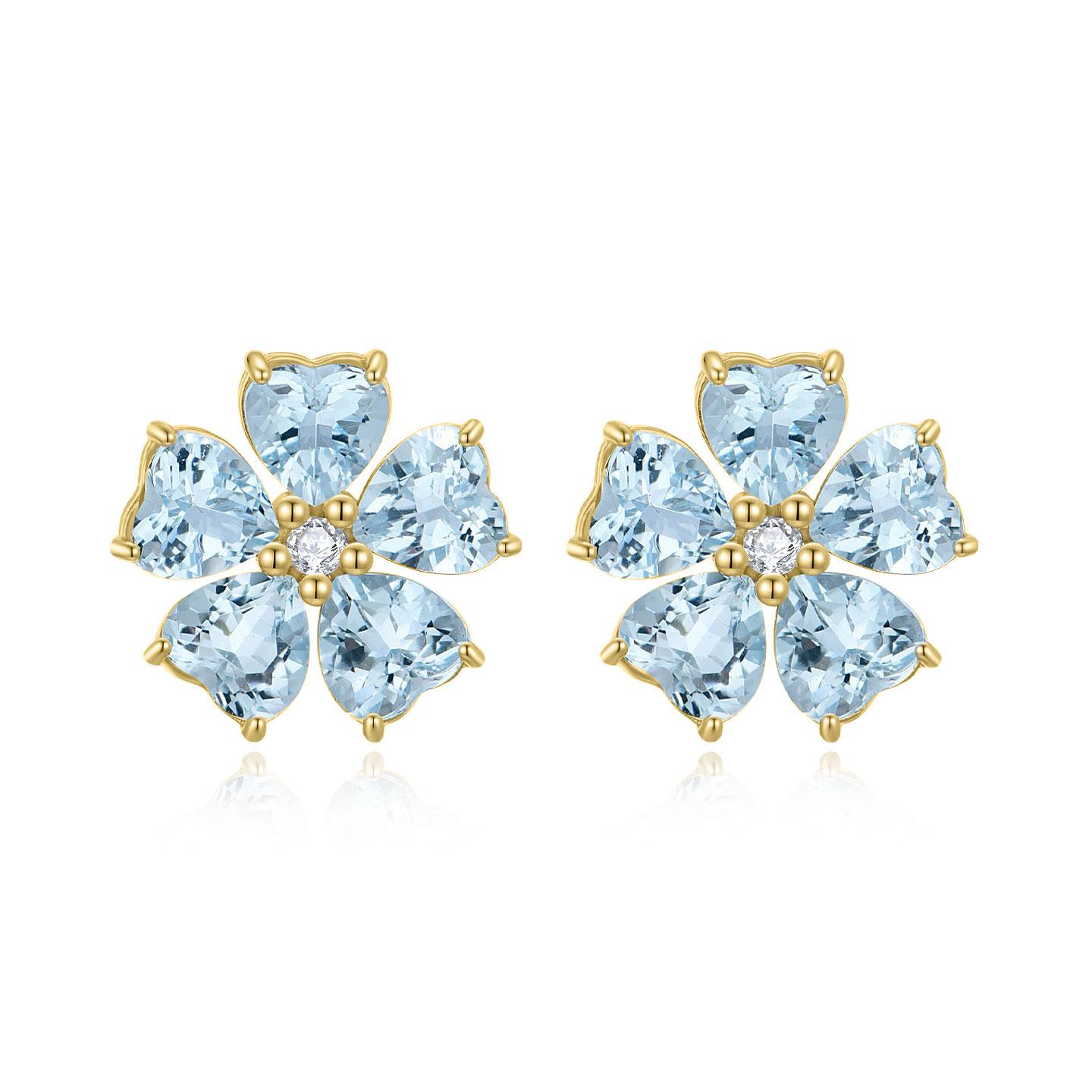 These stunning earrings capture the essence of springtime, featuring intricate designs inspired by the graceful cherry blossom. Artfully crafted, they showcase a harmonious blend of shimmering aquamarine gemstones and sparkling diamonds that exude