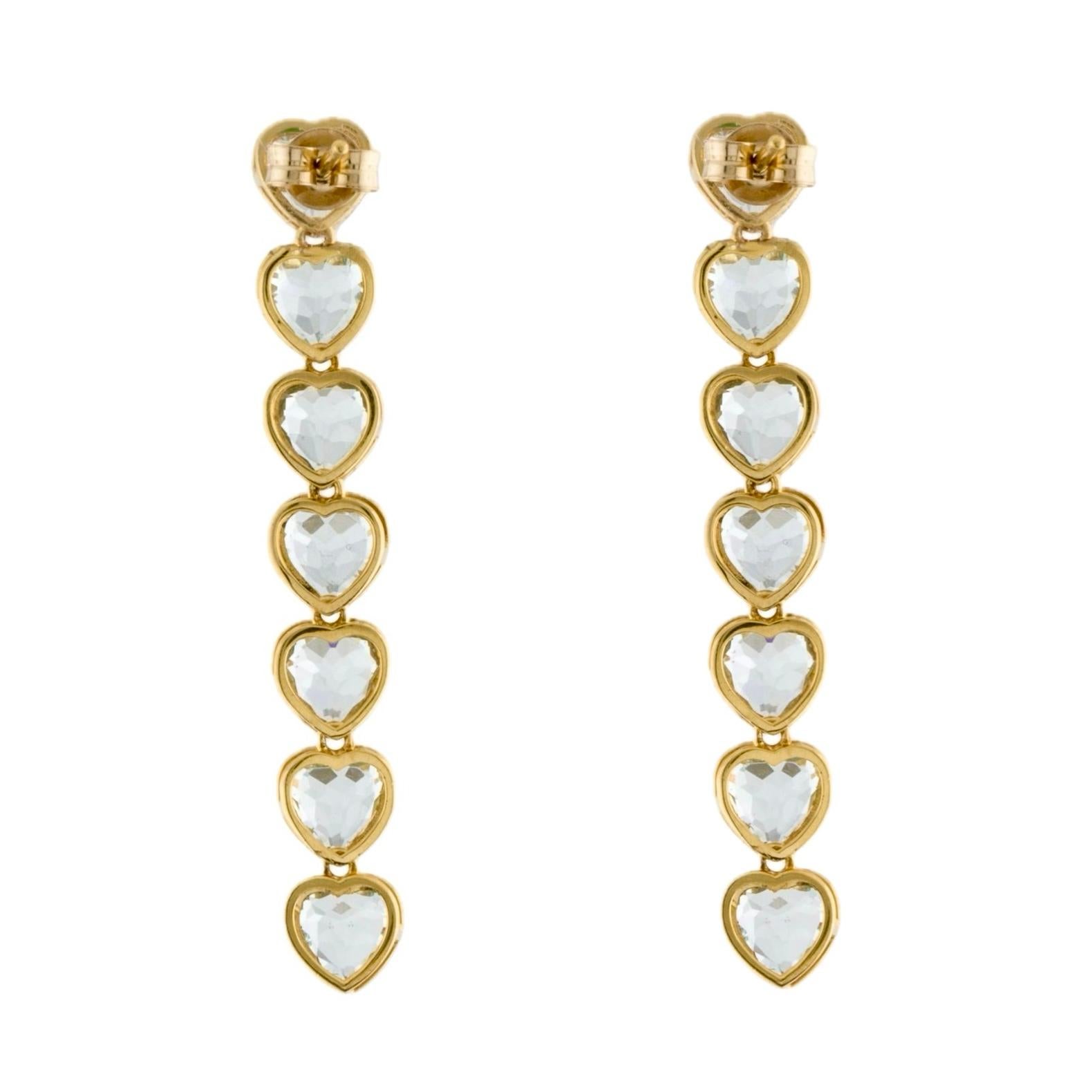 Dive into the romantic depths of Nina Zhou's Heart Shaped Aquamarine Line Drop Earrings, exquisitely set in lustrous 14k yellow gold. These masterpieces are a testament to love's eternal flow, featuring ethereal heart-shaped aquamarines that cascade