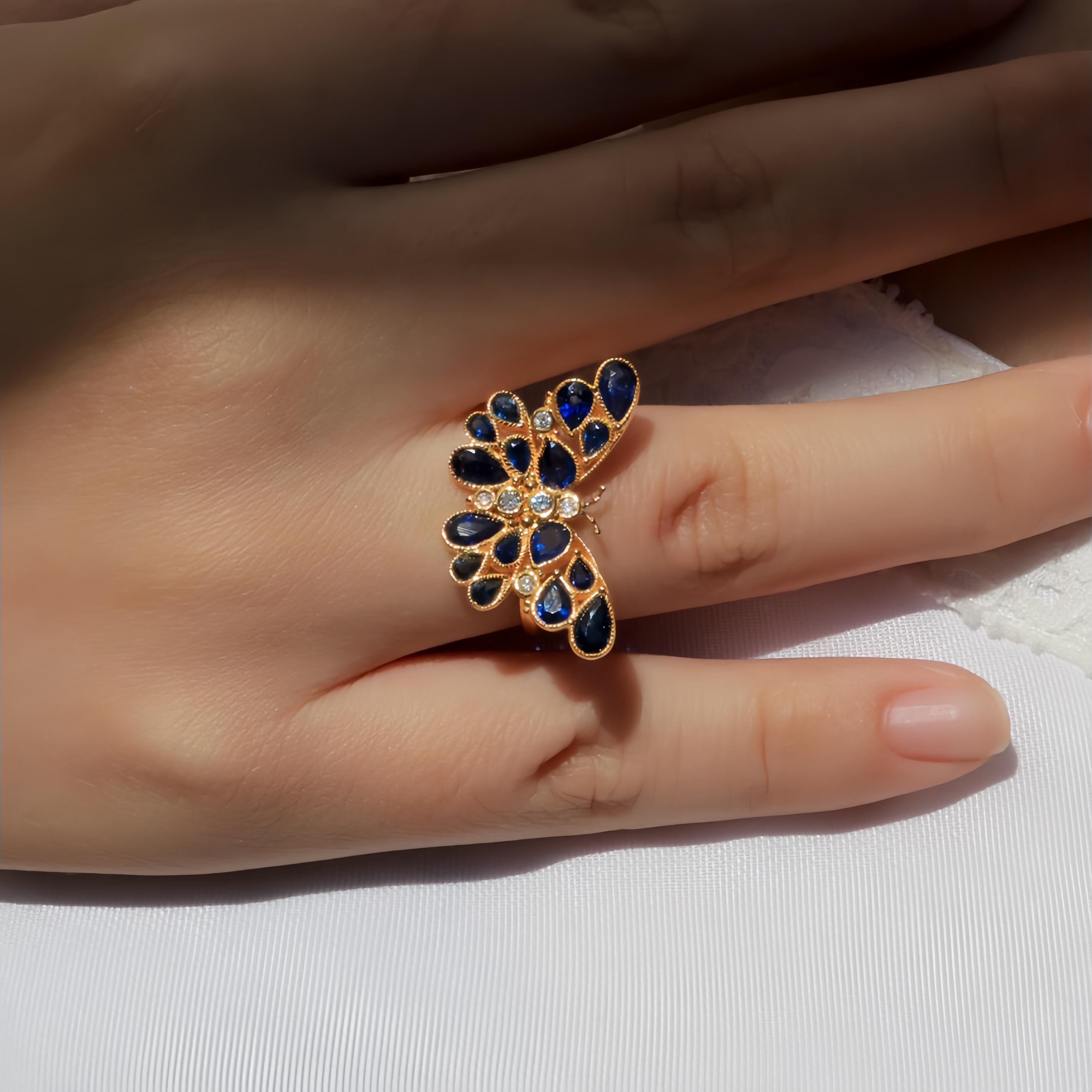 Step into a world of elegance and fantasy with the Nina Zhou Butterfly Sapphire Diamond Cocktail Ring. This exquisite piece, crafted in radiant yellow gold, brings together the deep, royal blue allure of sapphires with the brilliance of diamonds,