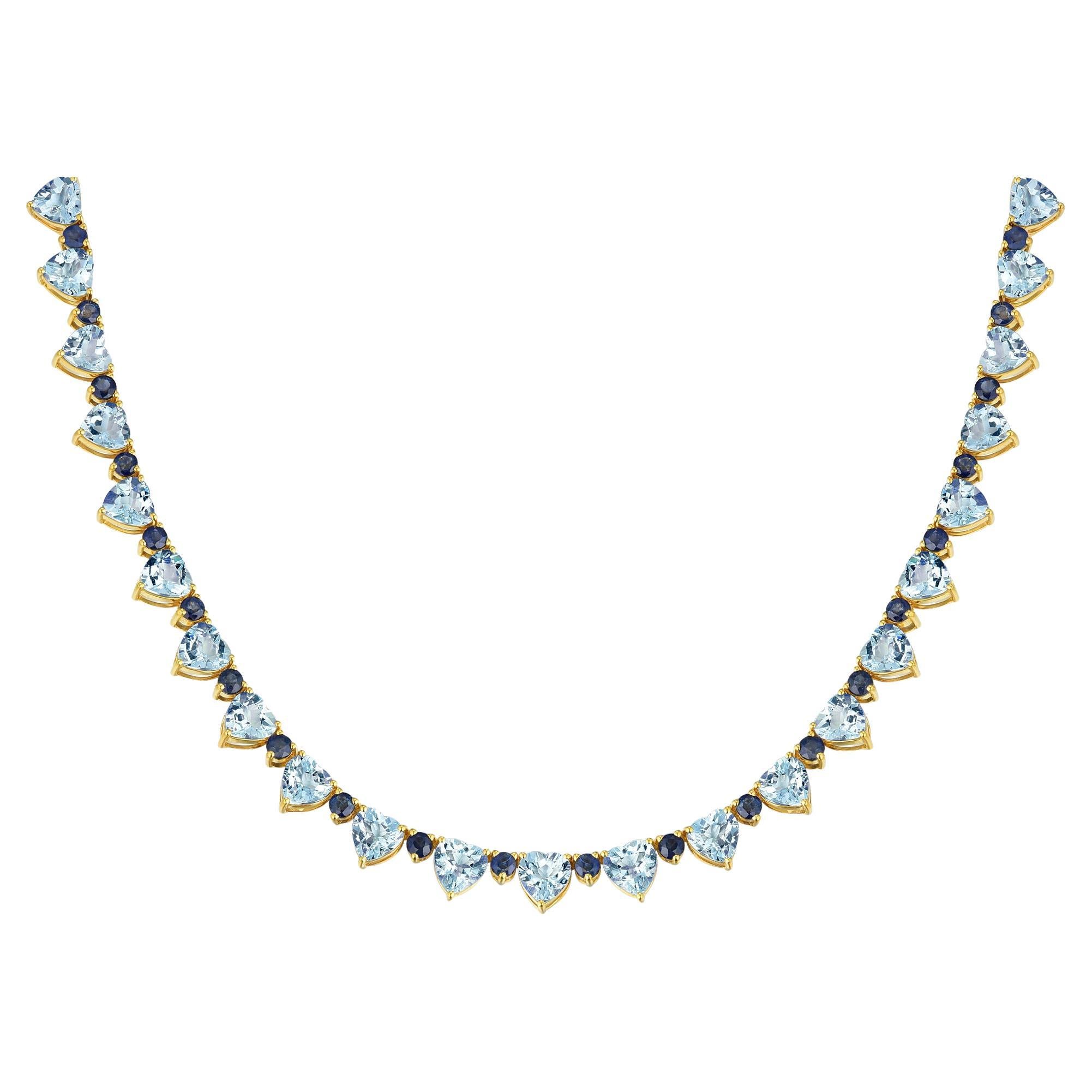 Embrace timeless romance and radiant elegance with the Nina Zhou Heart Aquamarine Sapphire DIamond Tennis Necklace. This stunning piece showcases a delicate arrangement of heart-shaped aquamarine gemstones paired with royal blue sapphires, exuding a