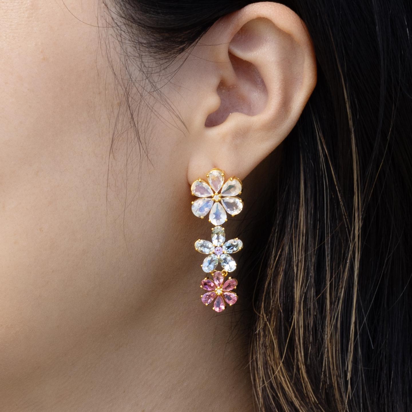 Nina Zhou's Moonstone Aquamarine Pink Sapphire Diamond Blossom Earrings, meticulously crafted in 14k yellow gold. These enchanting earrings feature alluring moonstone at the top, renowned for its captivating sheen and the subtle play of light