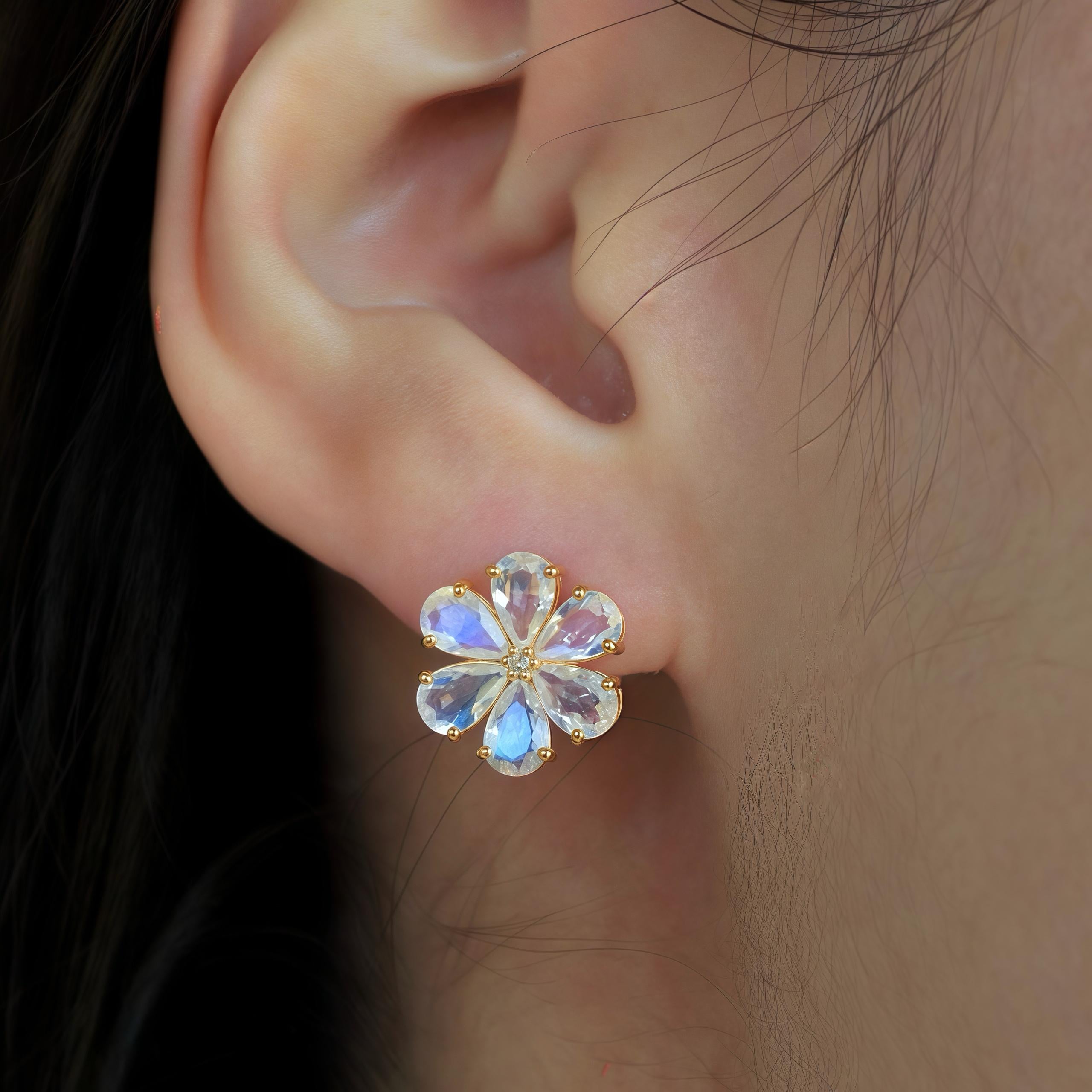 Nina Zhou's Moonstone Diamond Forget-me-not Earrings in 14k yellow gold elegantly capture the essence of timeless romance and delicate beauty. At the heart of each earring, a radiant diamond sparkles intensely, surrounded by petals crafted from