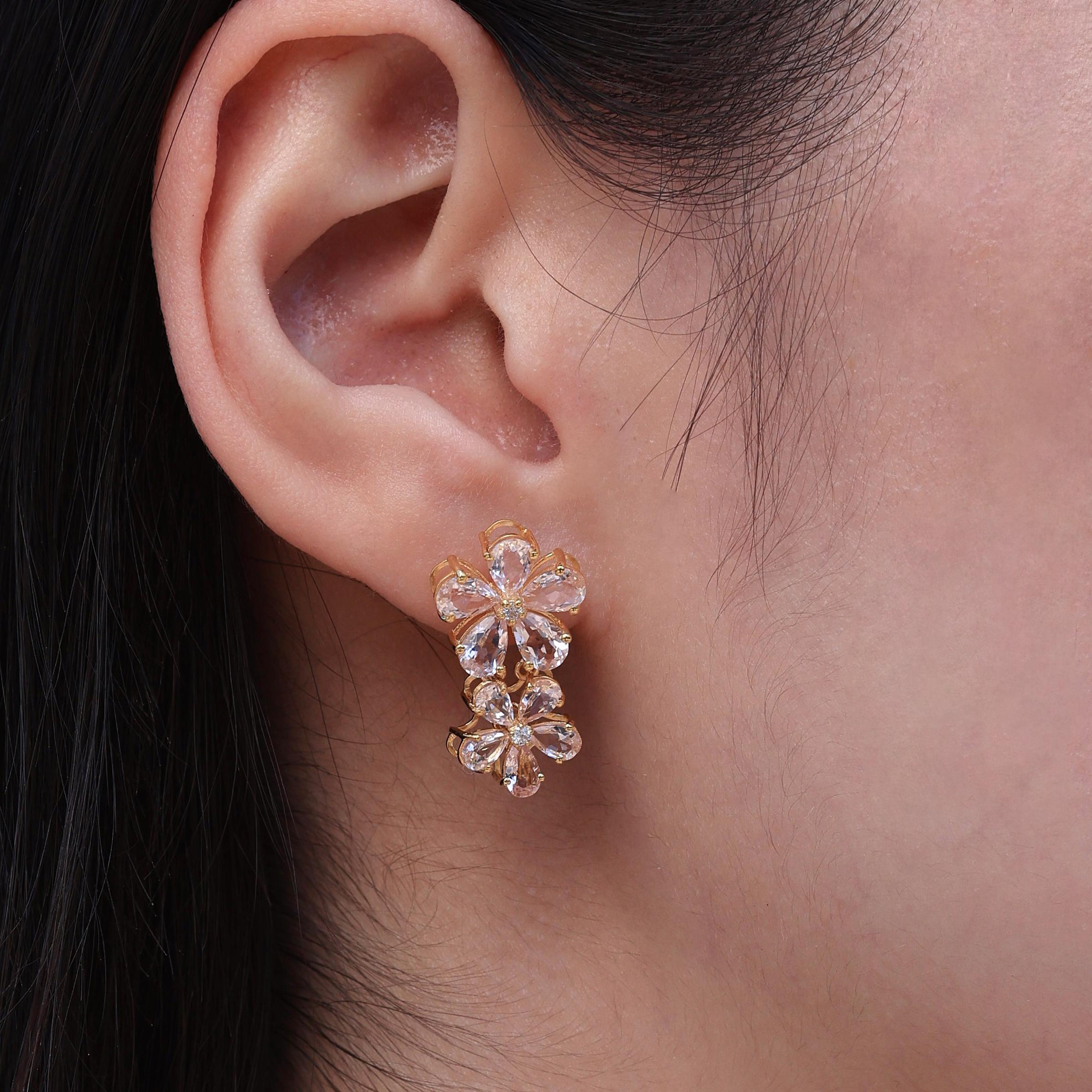 Elegance and femininity come together in the Nina Zhou's Pink Morganite Diamond Double Blossom Drop Earrings. Each earring showcases 10 pear-shaped, blush-pink morganites, known for their soft glow and eye-clean clarity. These gemstones are arranged
