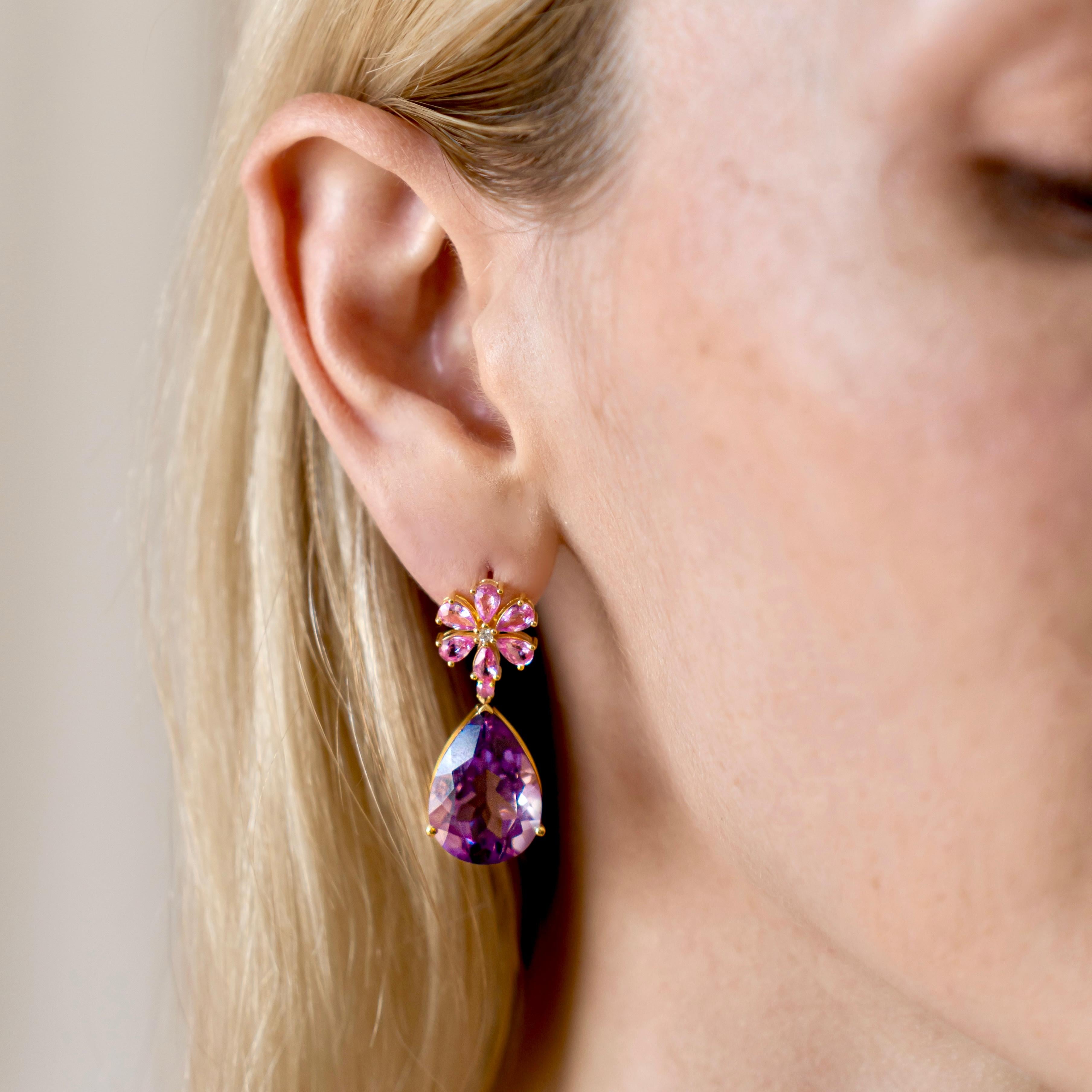 Experience the enchanting allure of Nina Zhou's Pink Sapphire Diamond Blossom 24ct Amethyst Drop Earrings, expertly crafted in radiant 14k yellow gold. Each earring begins with a delicate blossom, intricately formed by pink sapphires that capture