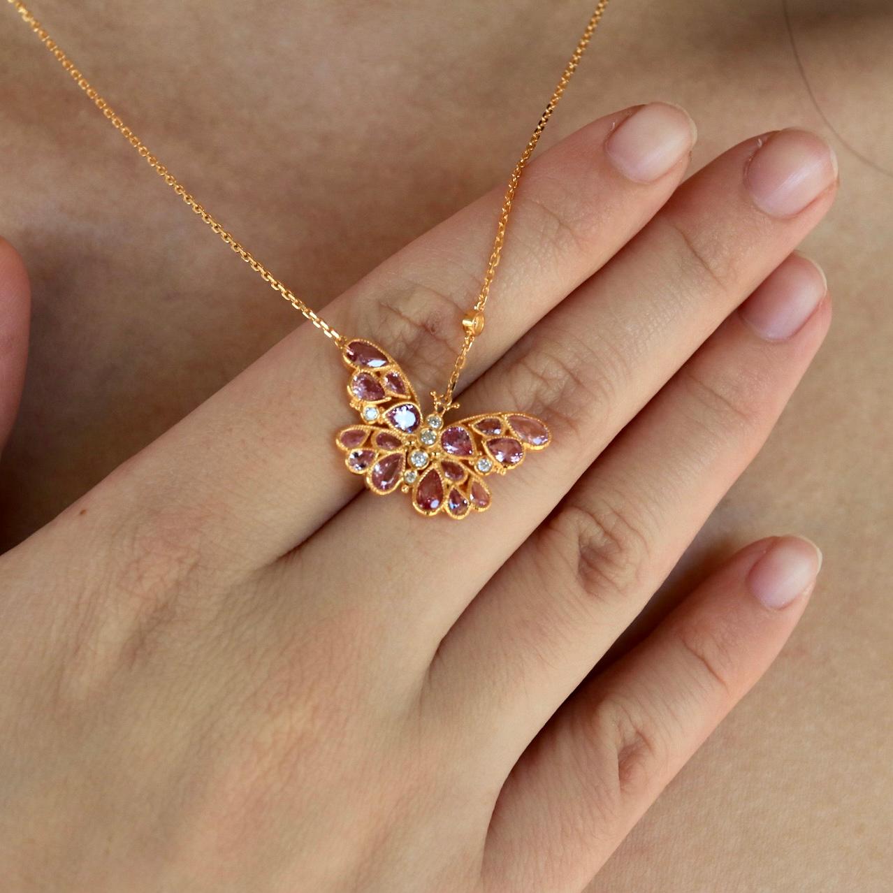 Celebrate the beauty of transformation with this stunning Pink Sapphire Diamond Butterfly Pendant Necklace. A delicate butterfly, crafted in gleaming 14K gold, comes alive with soft, rosy pink sapphires and brilliant diamonds. Each gemstone is set