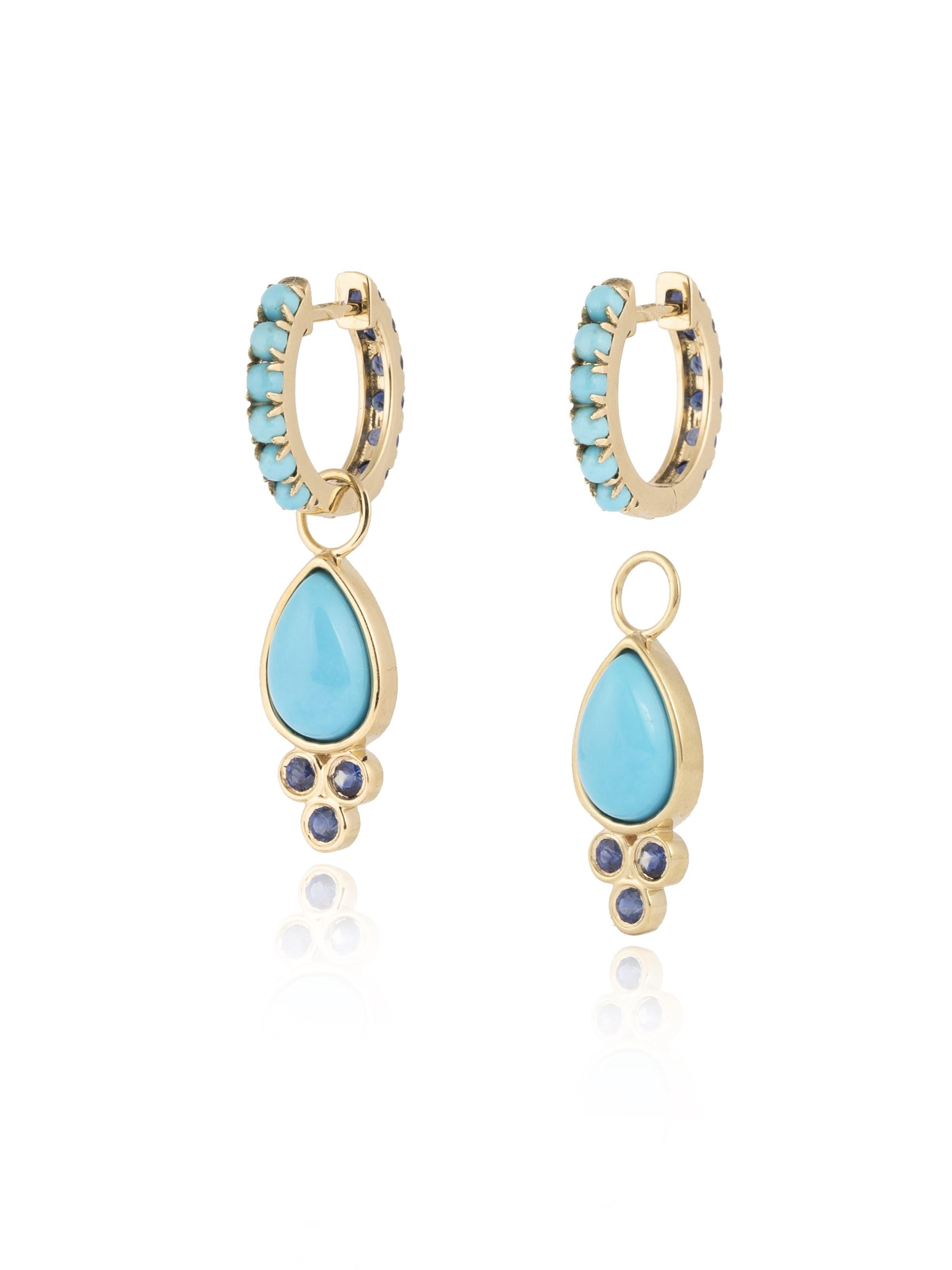 Discover Nina Zhou Sapphire and Turquoise Double-sided Hoop Earrings with Drop Enhancers. These exquisite earrings redefine elegance, featuring a stunning combination of sapphires and turquoise on both sides for a versatile look that's both playful