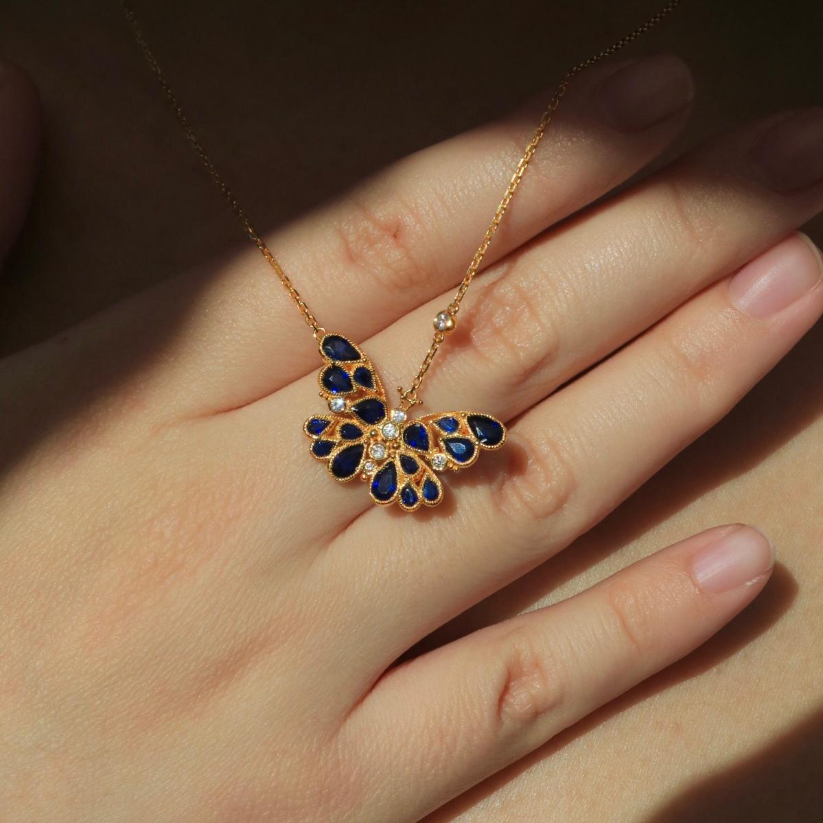 Embrace elegance and transformation with the Nina Zhou Sapphire Diamond Butterfly Pendant Necklace. This delicate masterpiece features a graceful butterfly, its wings brought to life with rich blue sapphires and sparkling diamonds, symbolizing