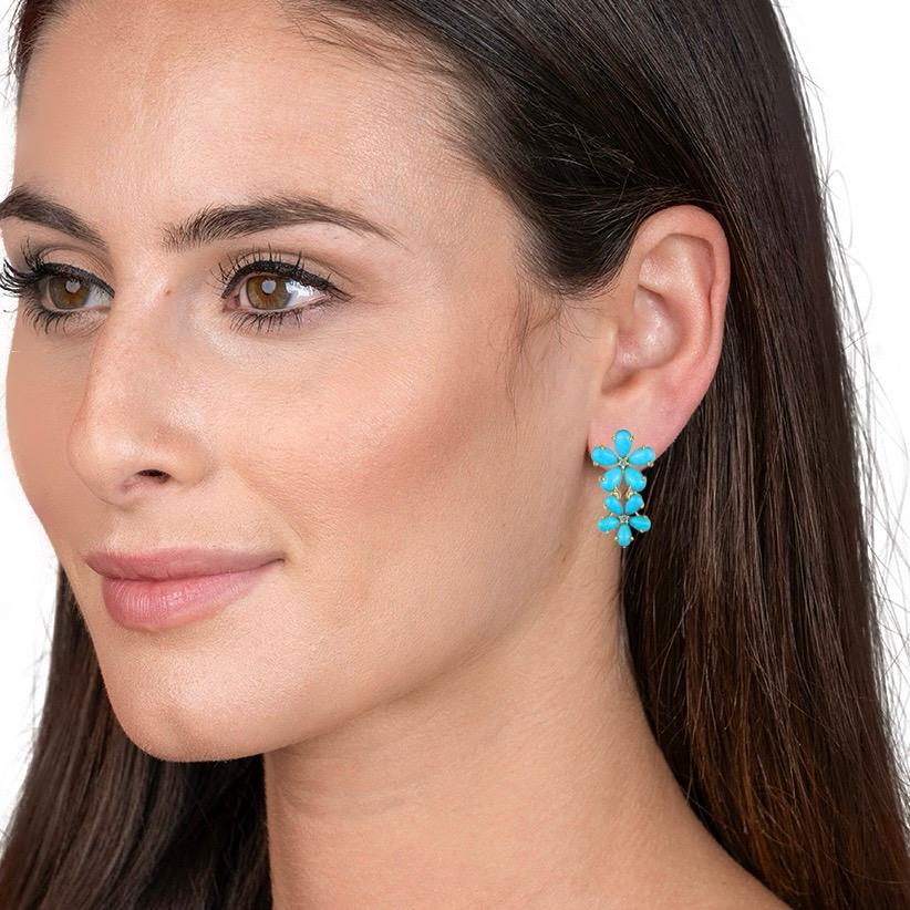 Unveil the enchanting allure of Nina Zhou's Turquoise Diamond Cherry Blossom Earrings, meticulously crafted in sumptuous 18k yellow gold. These exquisite pieces of jewelry pay homage to the ephemeral beauty of cherry blossoms, symbolizing renewal