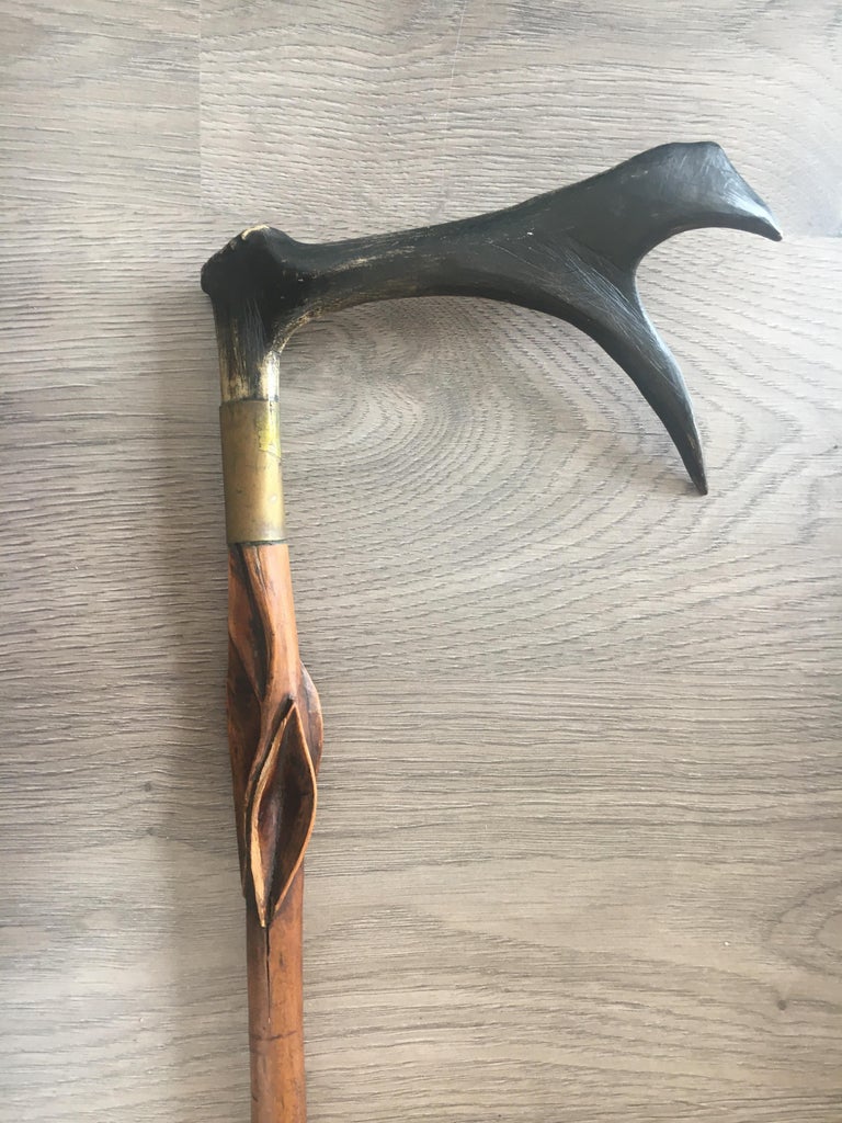 Nine AntlerMounted Canes and Walking Sticks, Some with Concealed