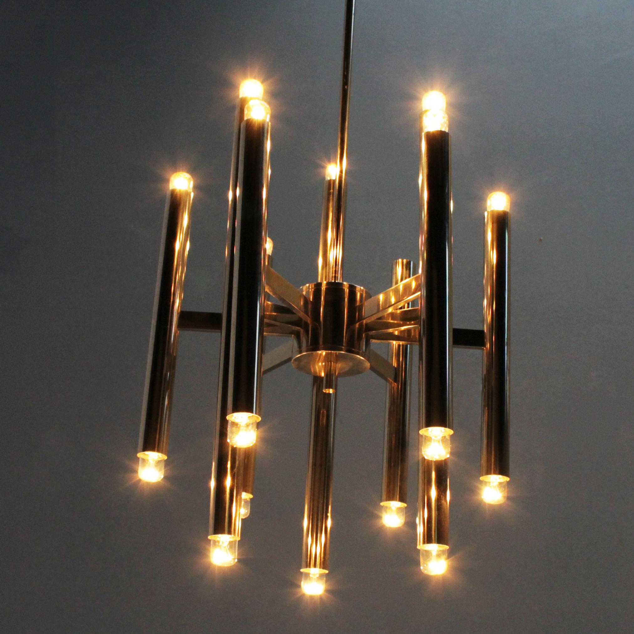 Chrome nine-arm tubular chandelier by Gaetano Sciolari with eighteen (18) lights. Lights on the top and the bottom. Small Edison screw (SES), (E17 14-17 mm) max 40 watt, the electricity is used but in a good condition, approved to European