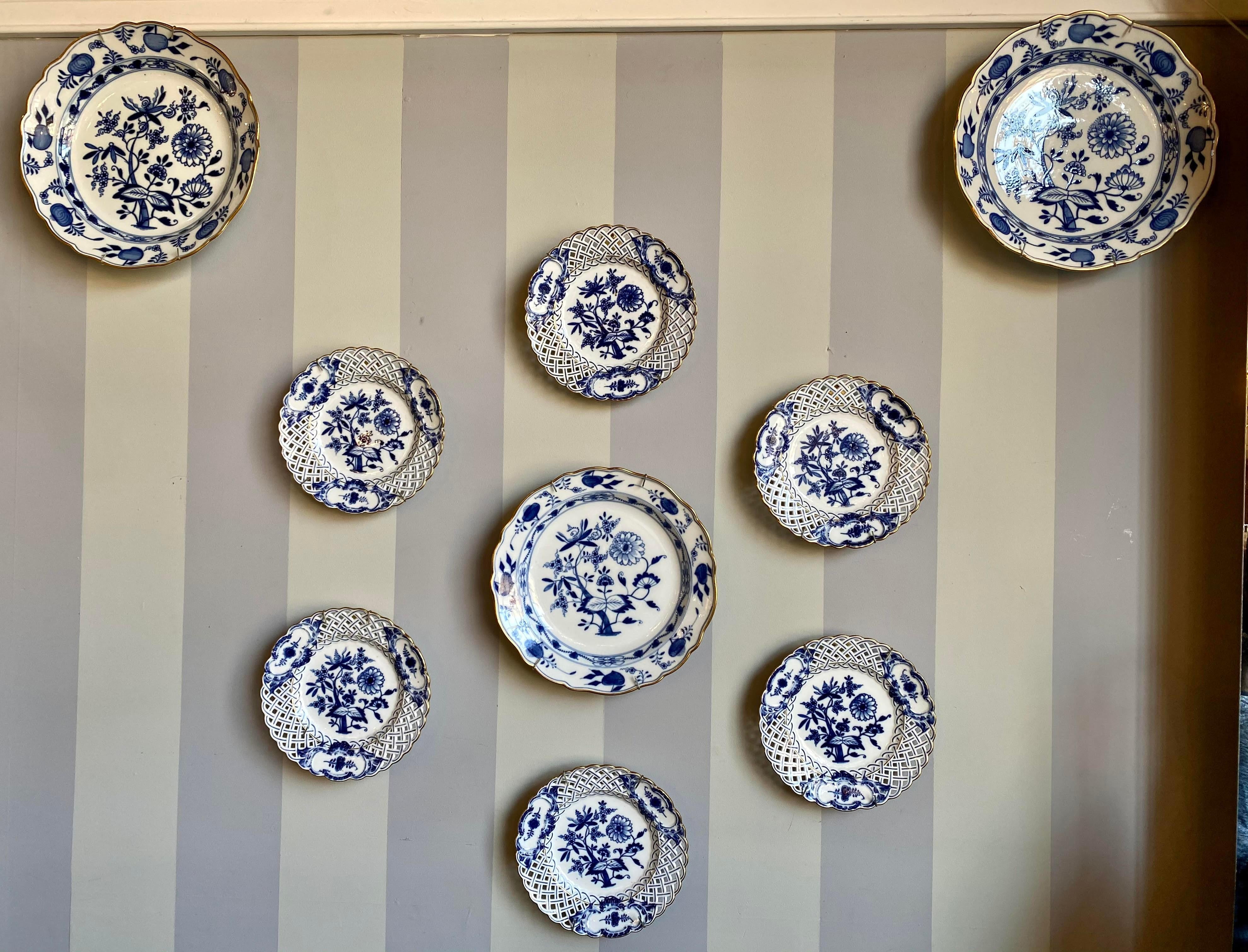 Nine blue onion Meissen show or wall plates. This is a stunning collection of blue white wall platters purchased from a NYC Socialite at the Beekman on the East side of Manhattan. These pieces are usually found one or two at a time. This collector