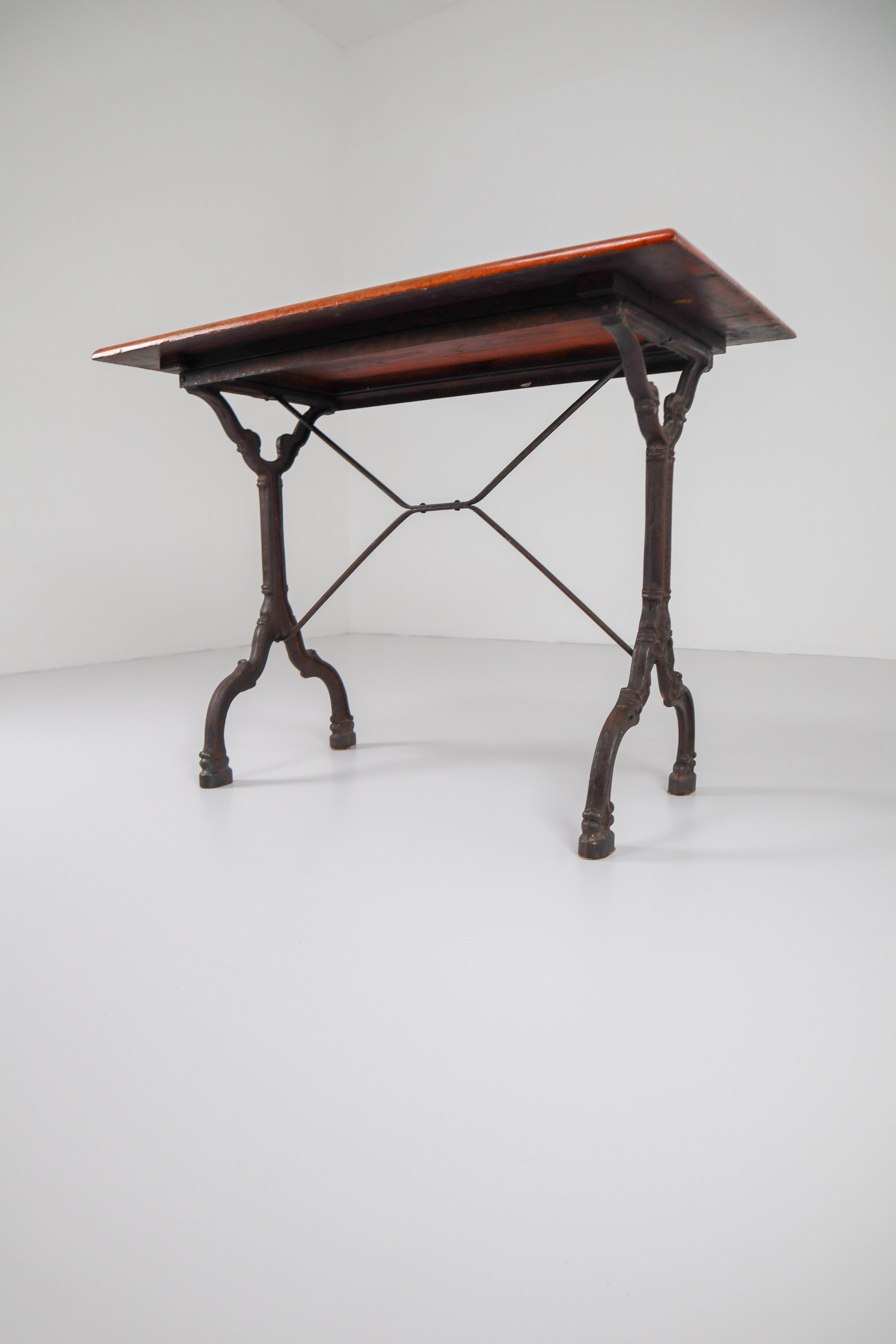 Nine Cast Iron Bistro Tables or Cafe Tables with Patinated Oak Top, France, 1900 4