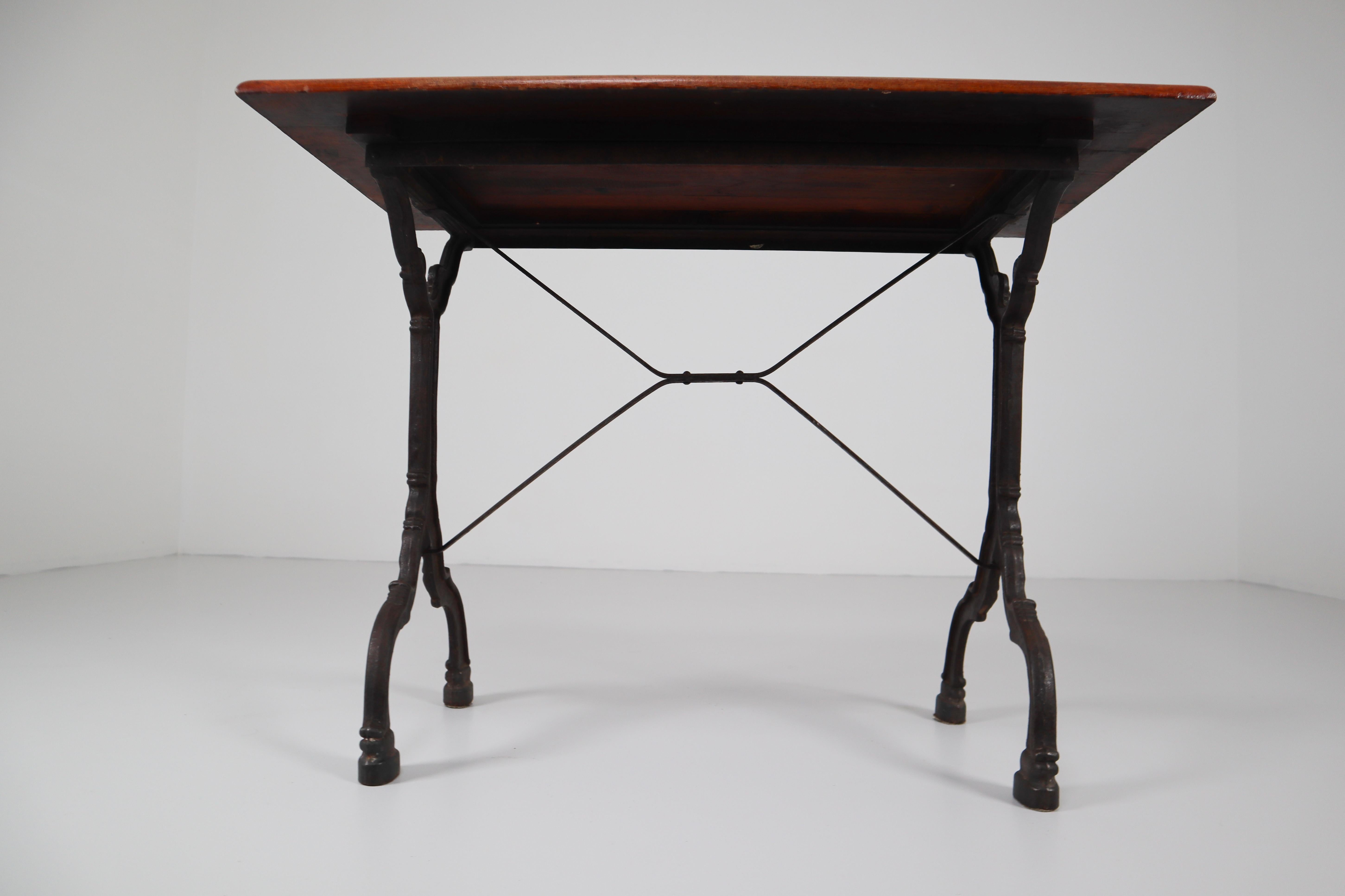 Nine Cast Iron Bistro Tables or Cafe Tables with Patinated Oak Top, France, 1900 5
