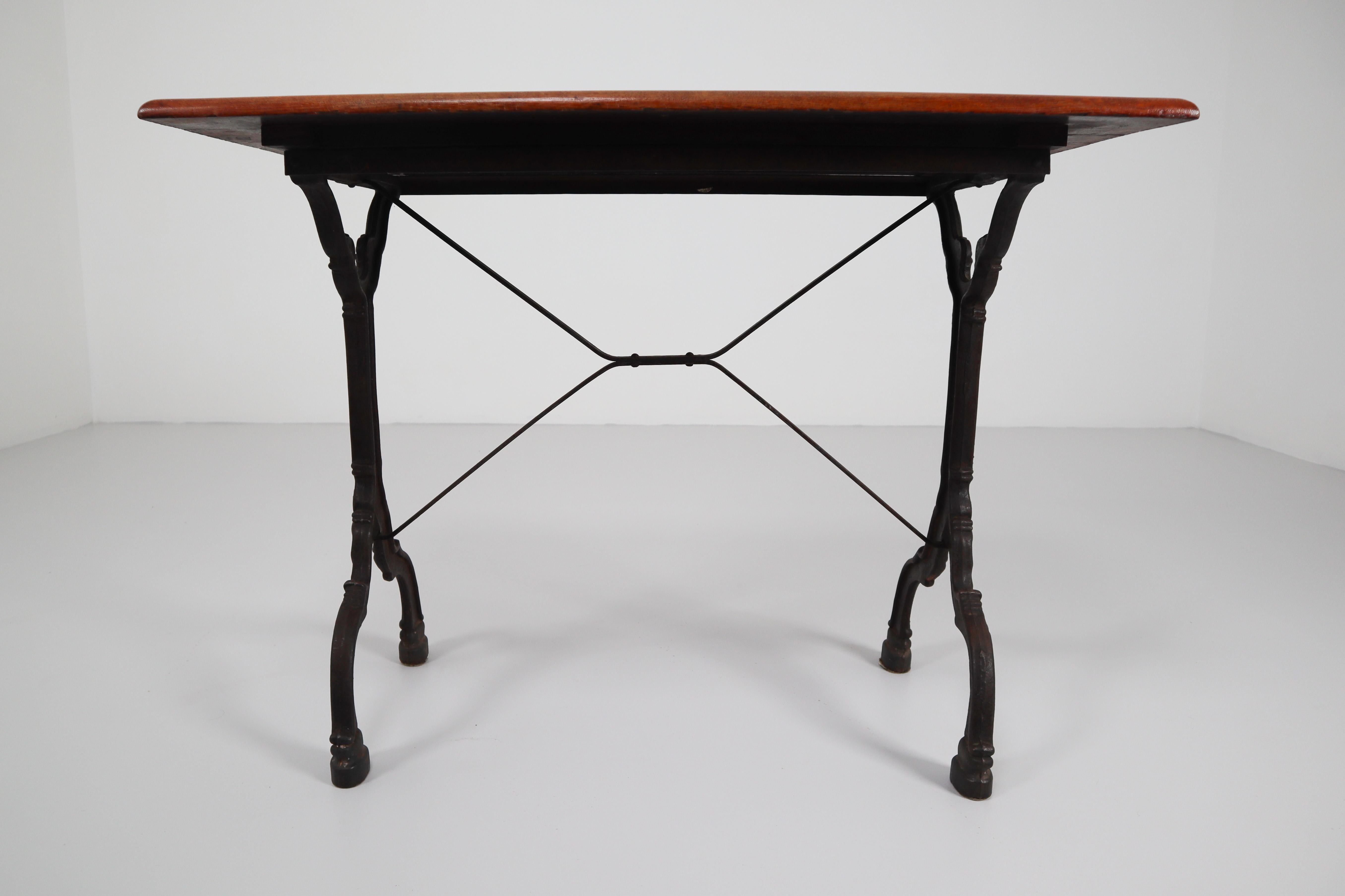 Jugendstil Nine Cast Iron Bistro Tables or Cafe Tables with Patinated Oak Top, France, 1900