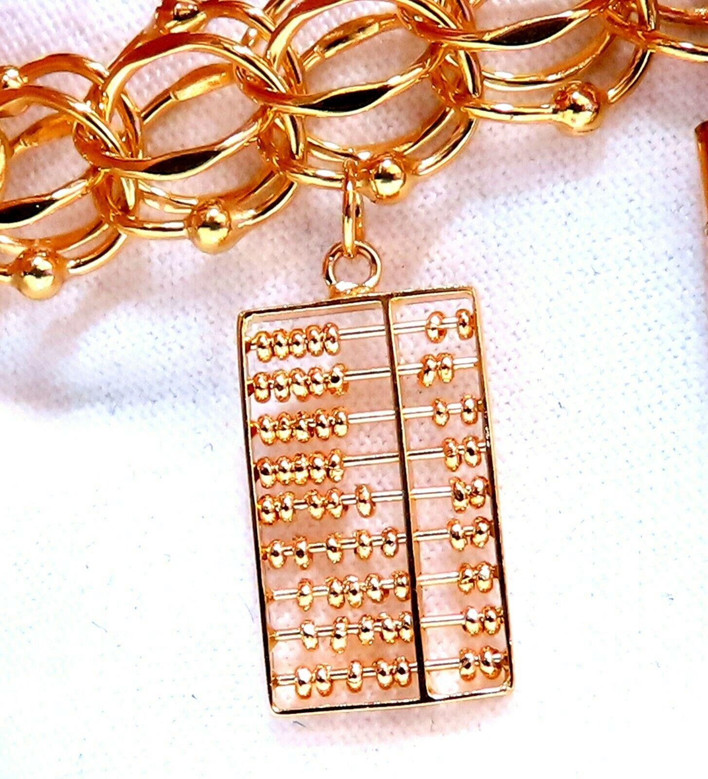 Nine Charms Link Bracelet 14kt Gold 54gm In New Condition For Sale In New York, NY
