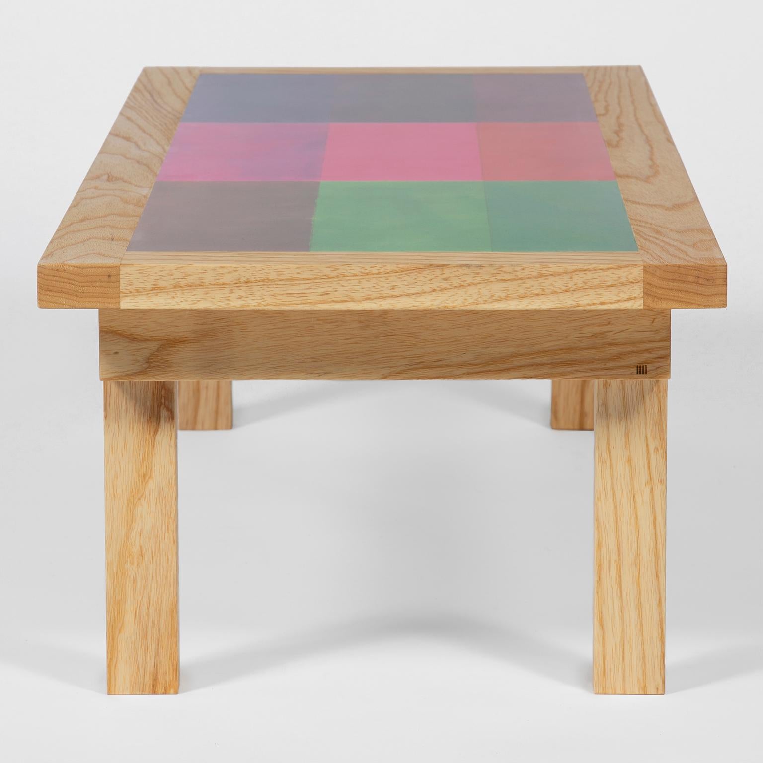 Small size low rectangular table featuring printed laminate facsimile taken from the original artwork by Robyn Denny as part of the DANAD Design collective (1958-1962).
The laminate surface art is set in a light Ash frame, handcrafted in the UK,