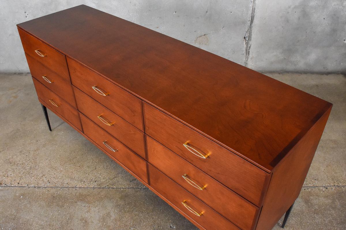 An uncommon nine-drawer dresser from the Contessa line produced by Heywood Wakefield in 1959. The Contessa line was in production for a fairly short period of time so while these pieces do turn up, it doesn't happen frequently. This example has been