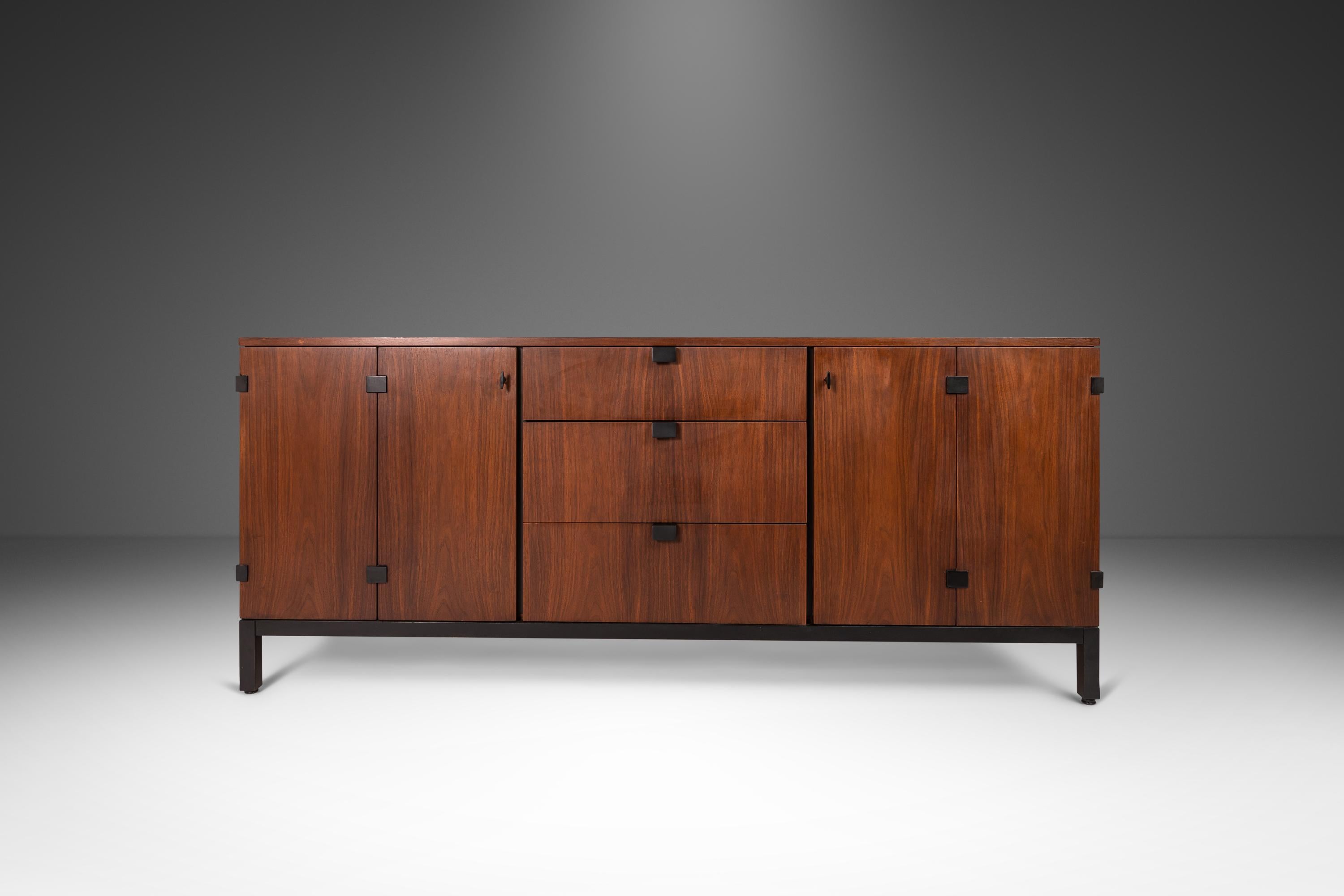 As rare as it is architecturally alluring this extraordinary nine-drawer dresser, designed by the prolific Milo Baughman for the Directional Furniture Co., is a true Mid-Century Modern gem. Constructed from a mix of solid and veneered black walnut