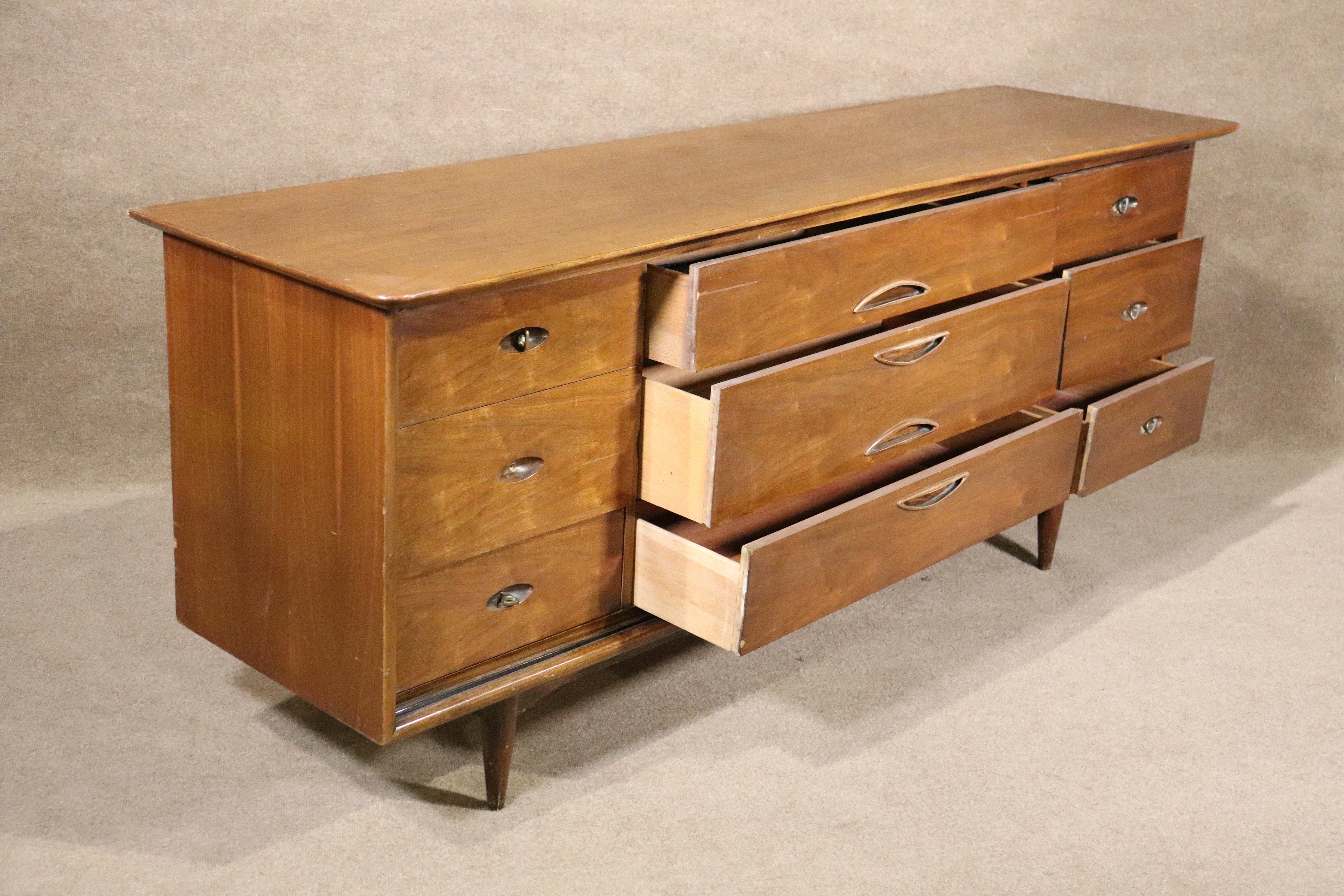 Long mid-century modern dresser made by Kent Coffey for their 