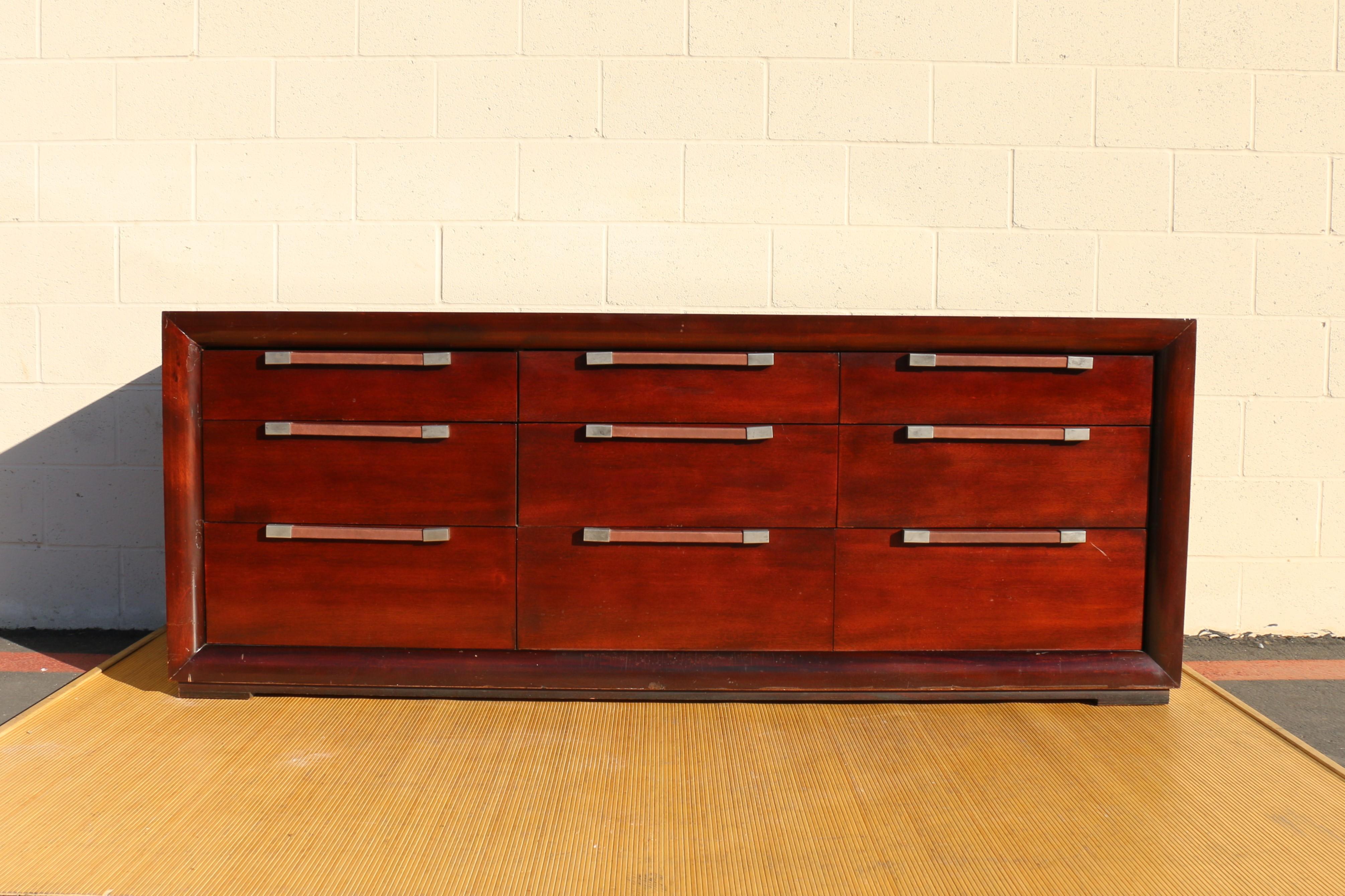 Wonderful dresser designed by Polo Ralph Lauren.  21st century. It has nine drawers that works well, they have leather and chrome handles. It has the Polo Ralph Lauren metal decal on inside of a drawer, ( shown in the picture). This dresser is in