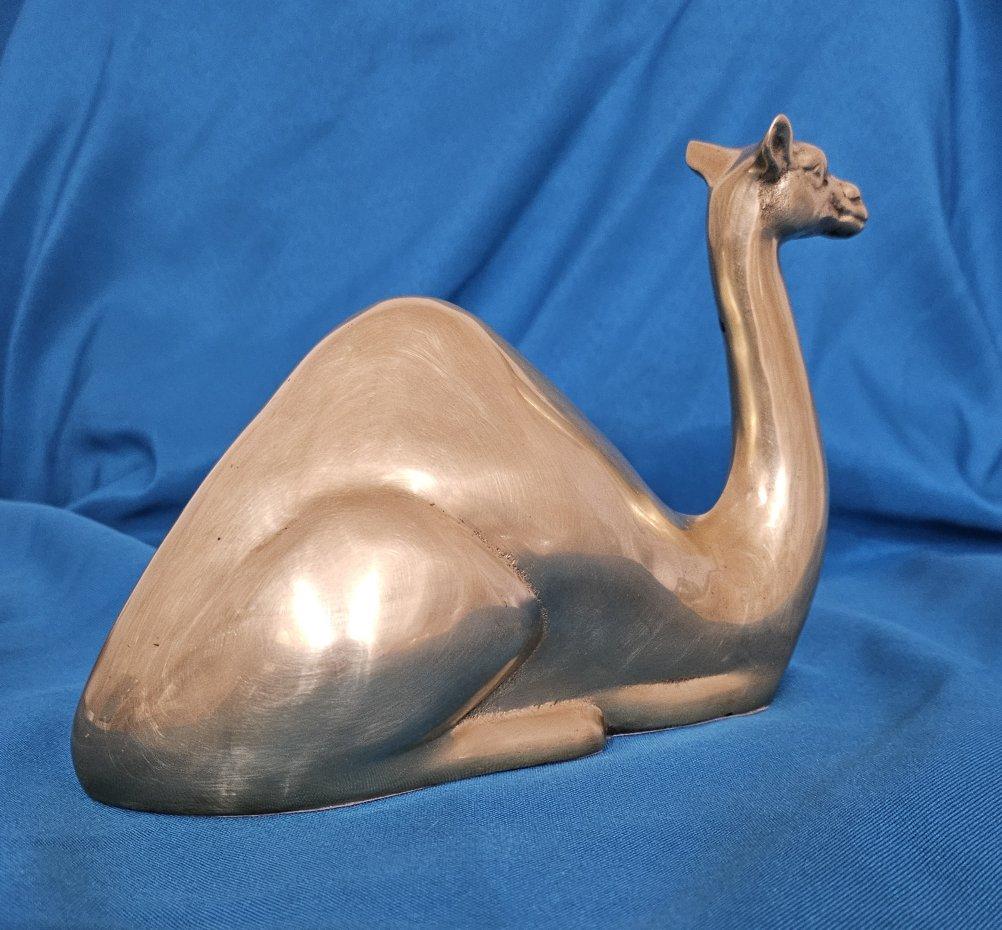 Nine Inch Mid-Century Modern Brass Camel Sculpture
A sizeable brass camel at an affordable price, this vintage piece measures approximately 9 x 6 x 3.5 inches.
It is in good vintage condition, having some areas of pitting/darkening and so on.
The