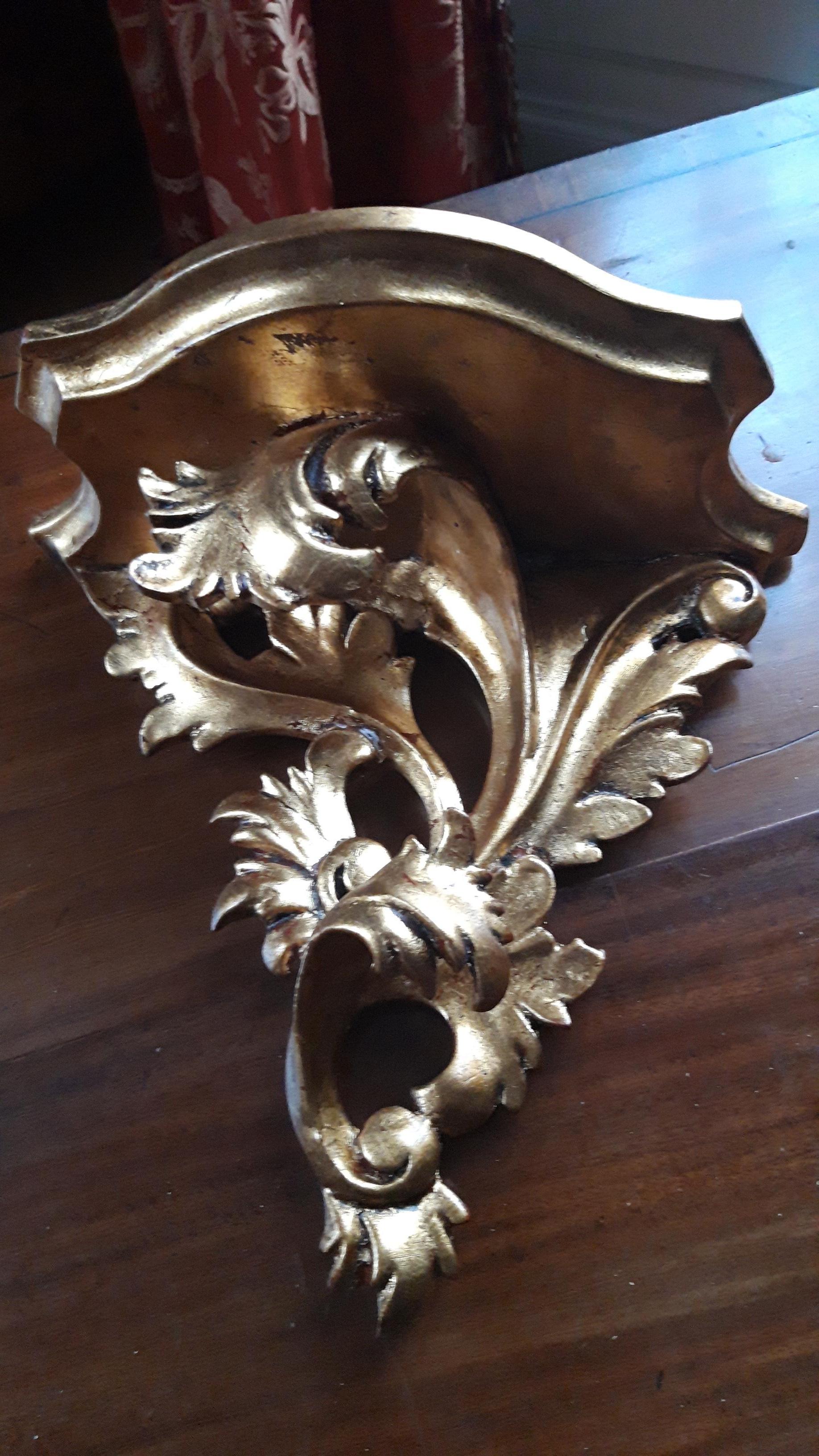 Nine large carved giltwood wall brackets.